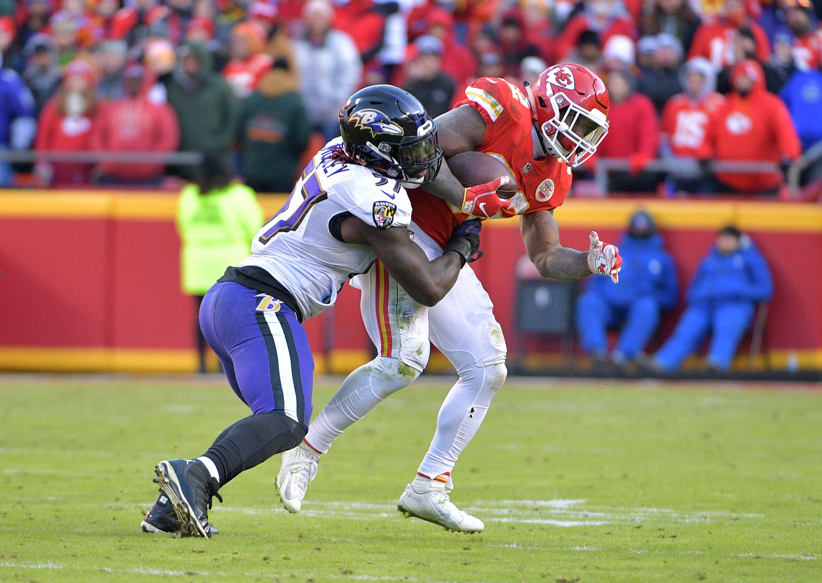 Dec 9, 2018; Kansas City, MO, USA; Kansas City Chiefs running back Spencer Ware (32) catches a pass and is tackled by Baltimore Ravens inside linebacker C.J. Mosley (57) during the second half at Arrowhead Stadium. Mandatory Credit: Denny Medley-USA TODAY Sports / Denny Medley