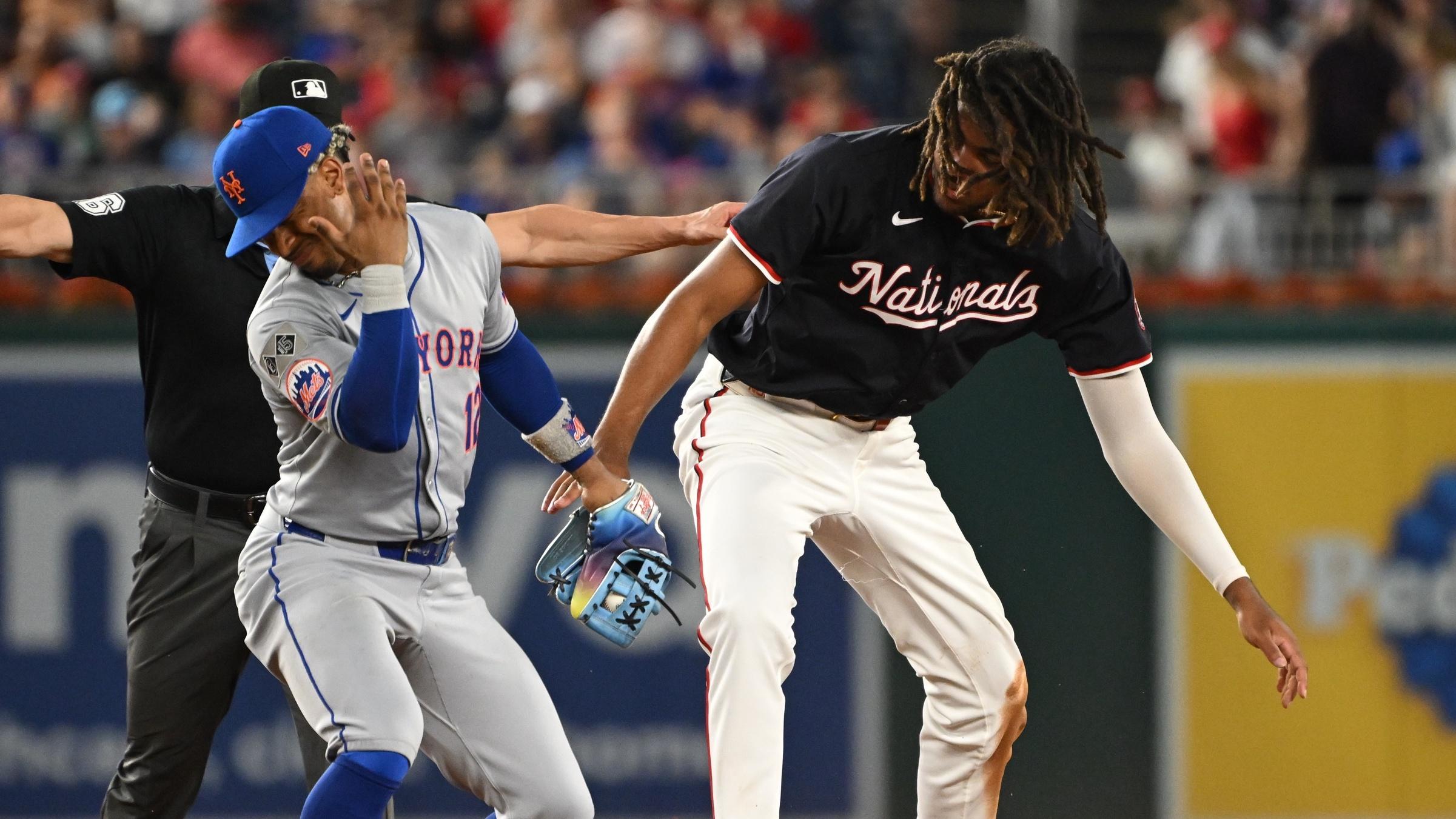 New York Mets shortstop Francisco Lindor (12) reacts after colliding with Washington Nationals center fielder James Wood (50) at second base during the seventh inning at Nationals Park.