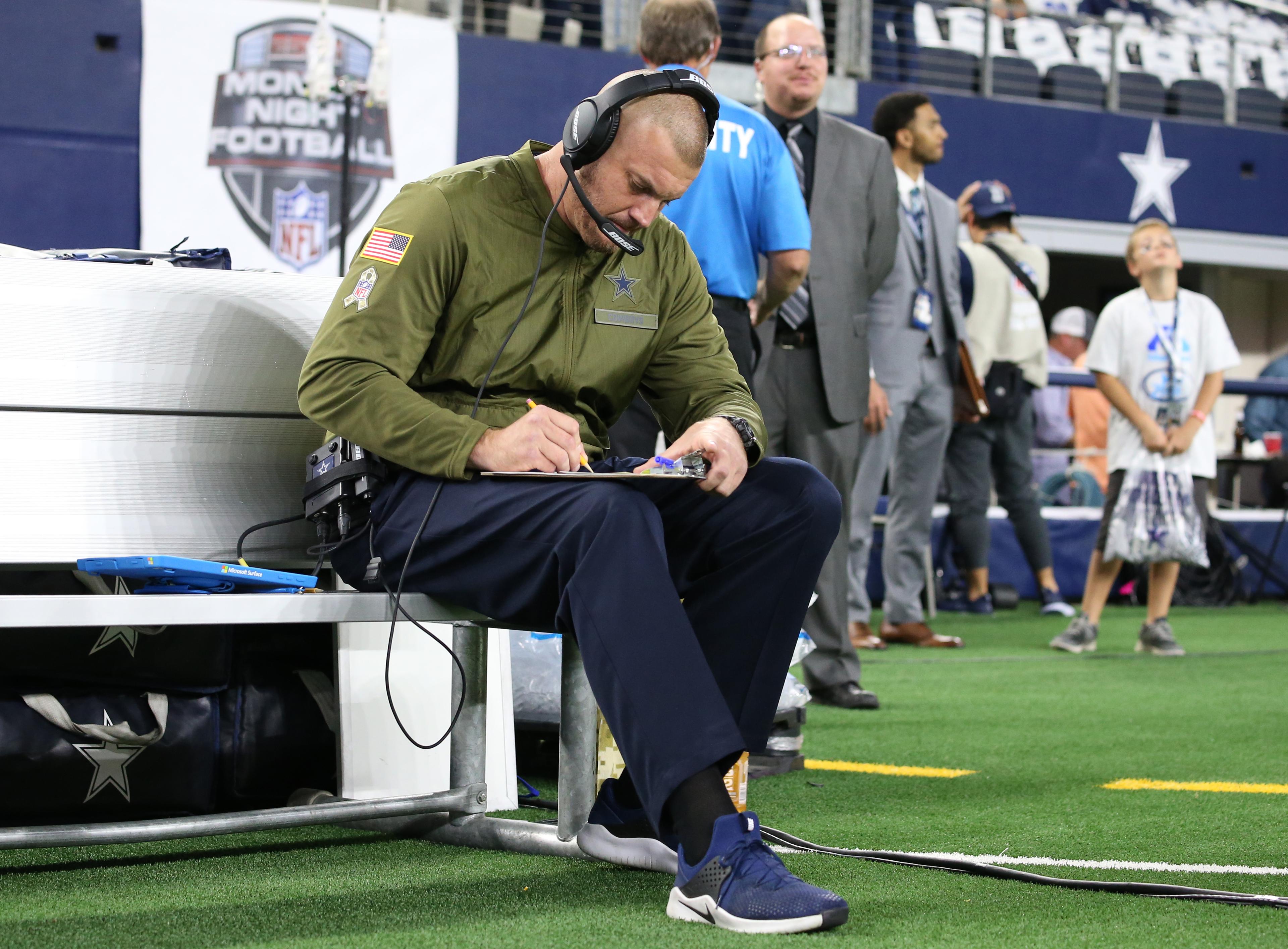 Nov 5, 2018; Arlington, TX, USA; Dallas Cowboys offensive line coach Marc Colombo sits on the bench prior to the game against the Tennessee Titans at AT&T Stadium. Mandatory Credit: Matthew Emmons-USA TODAY Sports