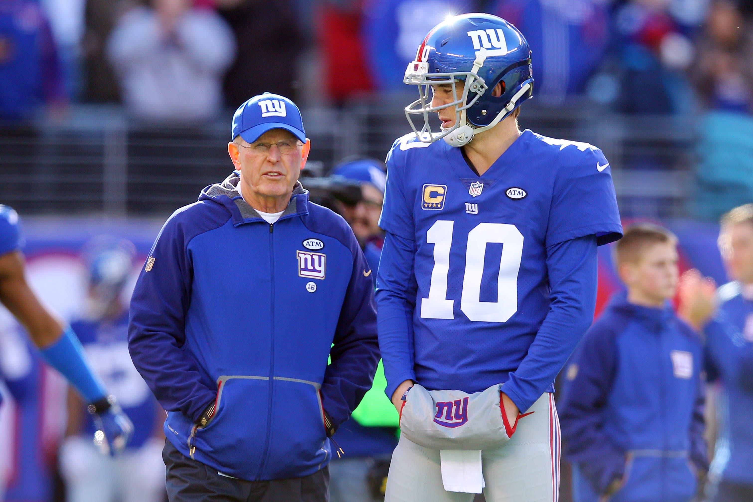 Jan 3, 2016; East Rutherford, NJ, USA; New York Giants head coach Tom Coughlin (L) talks to quarterback Eli Manning (10) prior to their game against the Philadelphia Eagles at MetLife Stadium. Mandatory Credit: Brad Penner-USA TODAY Sports / Brad Penner