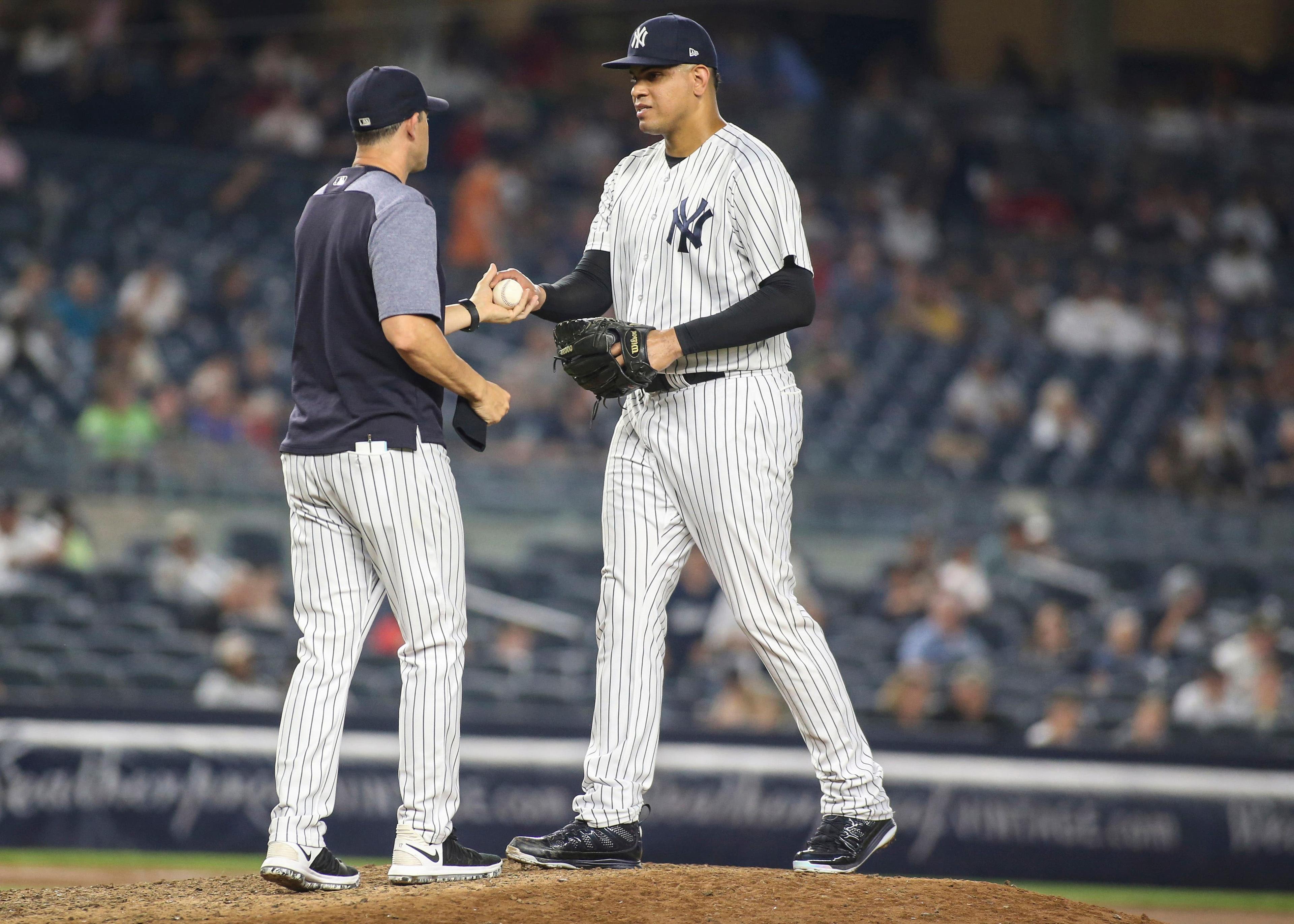 Jul 1, 2018; Bronx, NY, USA; New York Yankees manager Aaron Boone (17) comes out in the ninth inning to take out pitcher Dellin Betances (68) against the Boston Red Sox at Yankee Stadium. Mandatory Credit: Wendell Cruz-USA TODAY Sports / Wendell Cruz