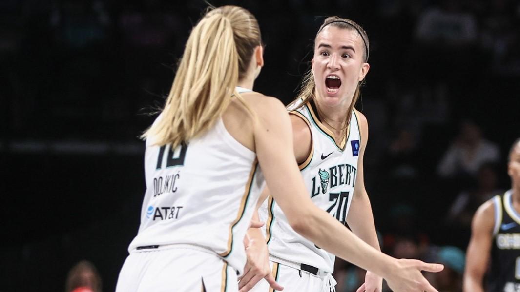 May 23, 2024; Brooklyn, New York, USA; New York Liberty guard Sabrina Ionescu (20) celebrates with guard Ivana Dojkic (18) at the end of the first quarter against the Chicago Sky at Barclays Center. / Wendell Cruz-USA TODAY Sports