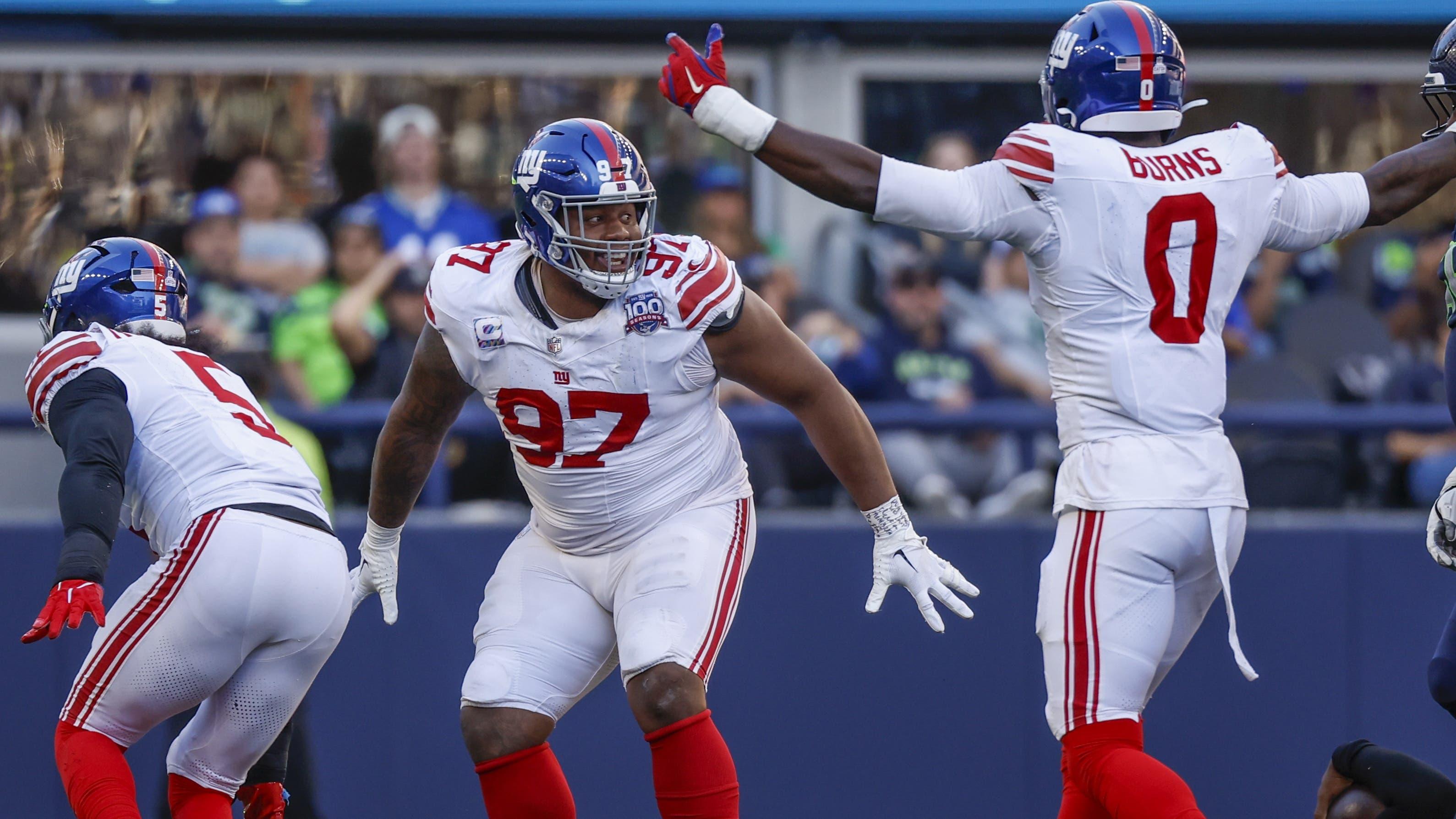 New York Giants defensive tackle Dexter Lawrence II (97) celebrates following a fourth down sack against the Seattle Seahawks during the fourth quarter at Lumen Field