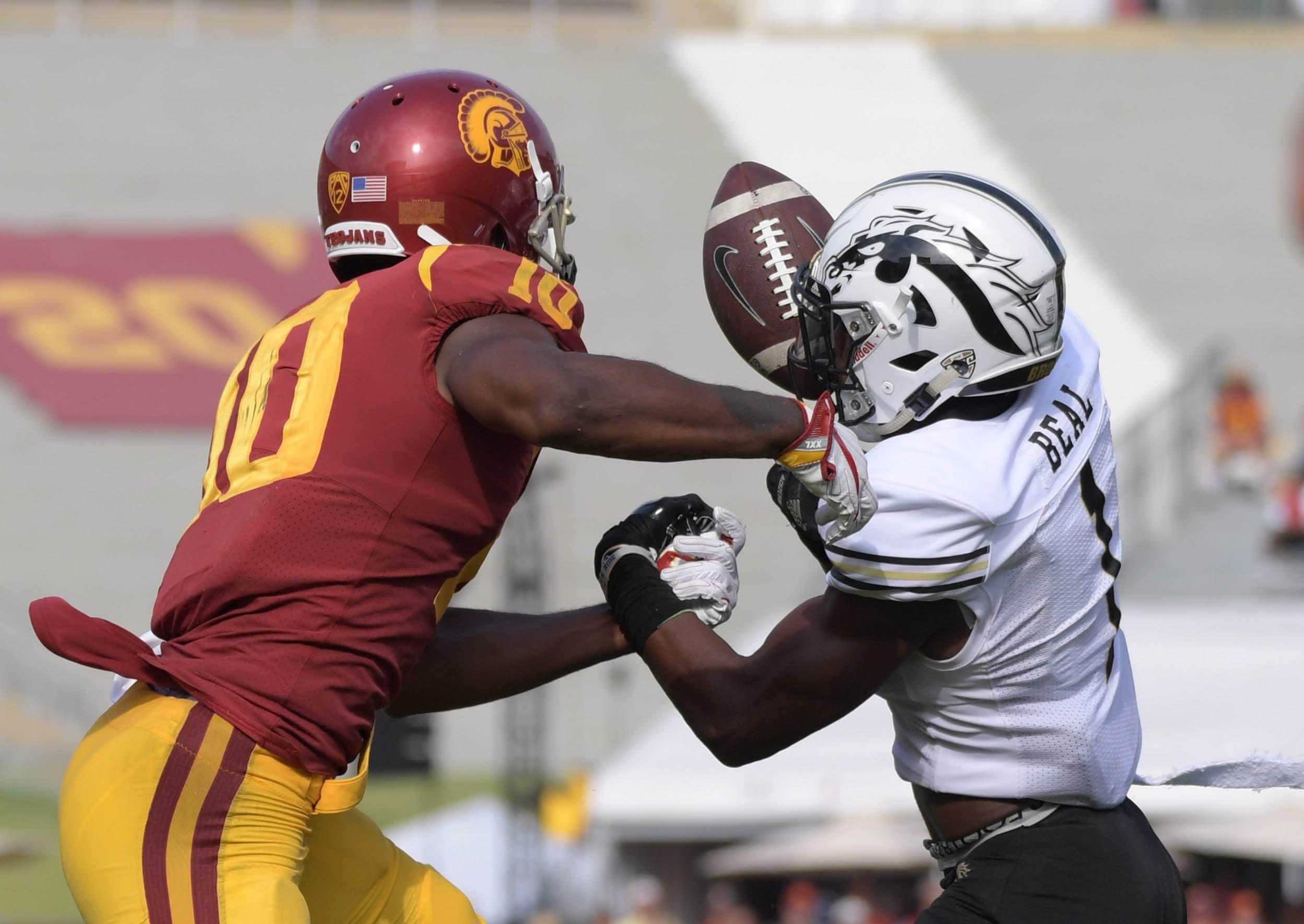 Sep 2, 2017; Los Angeles, CA, USA; Western Michigan Broncos defensive back Sam Beal (1) intercepts a pass intended for Southern California Trojans wide receiver Jalen Greene (10) during a NCAA football game at Los Angeles Memorial Coliseum. USC defeated Western Michigan 49-31. Mandatory Credit: Kirby Lee-USA TODAY Sports / Kirby Lee