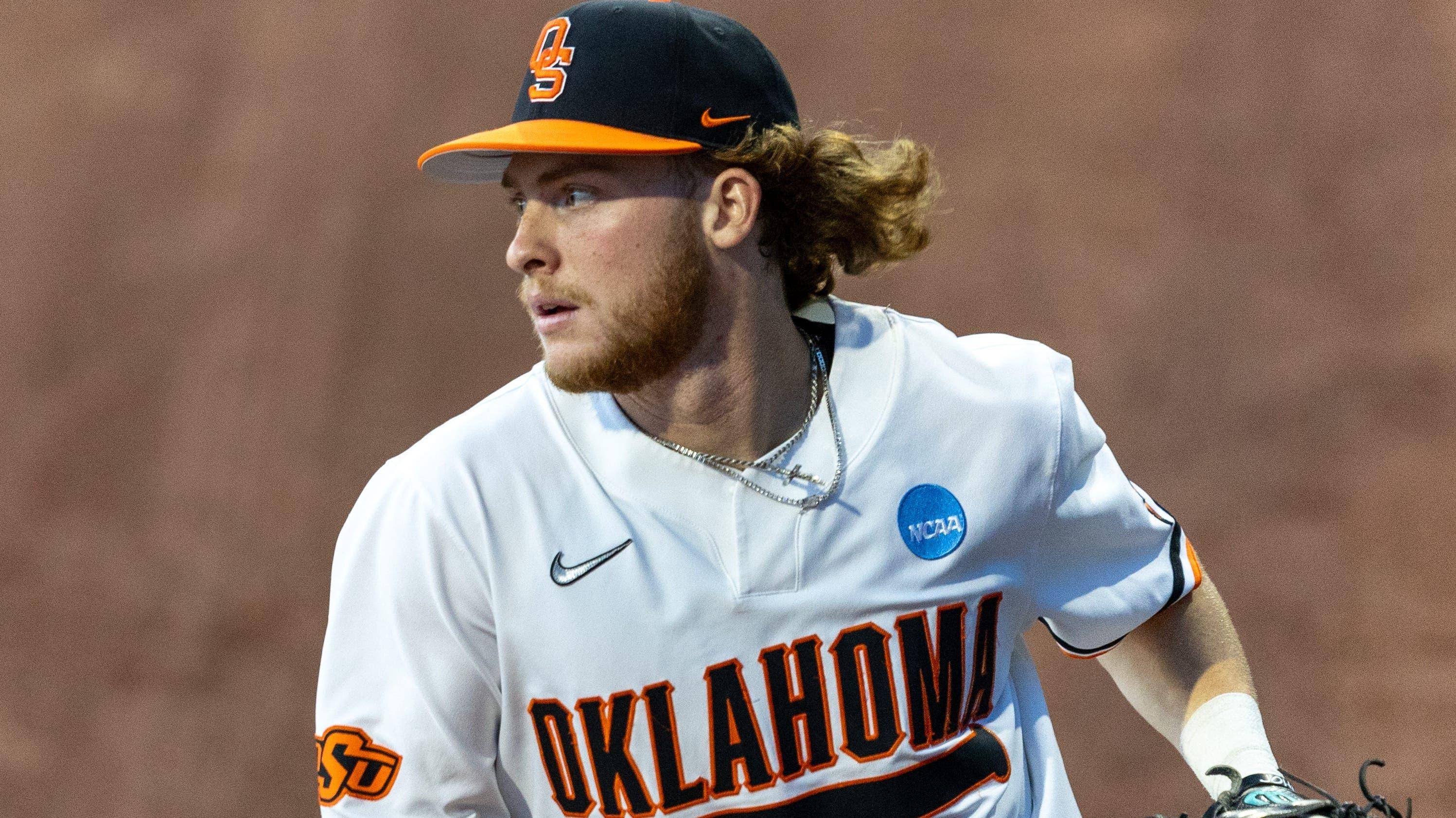 Oklahoma State utility Carson Benge (3) catches the ball in the outfield during a regional NCAA Baseball game against Niagara at O'Brate Stadium / Mitch Alcala - For The Oklahoman