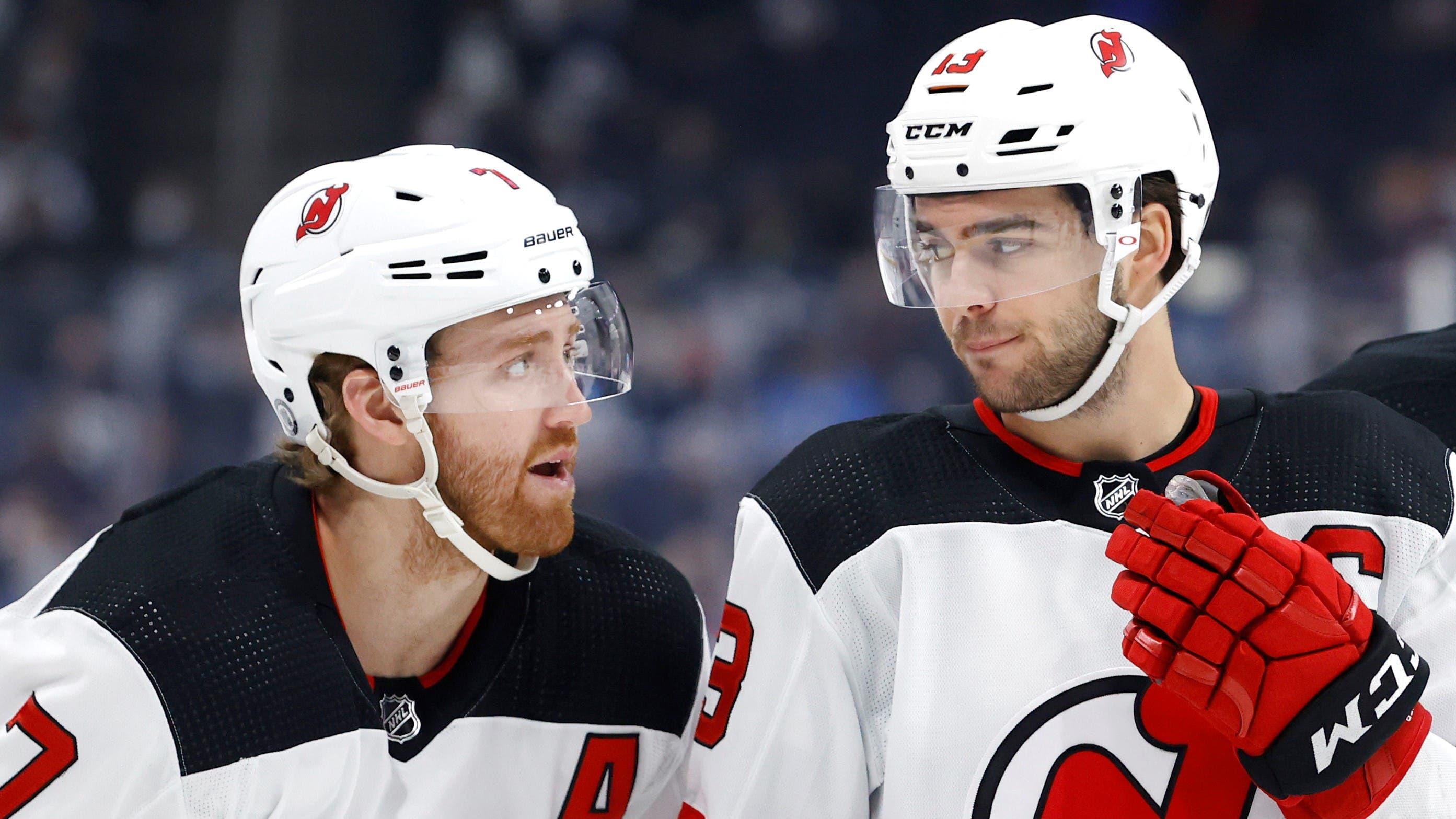 Dec 3, 2021; Winnipeg, Manitoba, CAN; New Jersey Devils defenseman Dougie Hamilton (7), New Jersey Devils center Nico Hischier (13) and New Jersey Devils defenseman Ryan Graves (33) talk before a face off against the Winnipeg Jets in the first period at Canada Life Centre. Mandatory Credit: James Carey Lauder-USA TODAY Sports / James Carey Lauder-USA TODAY Sports