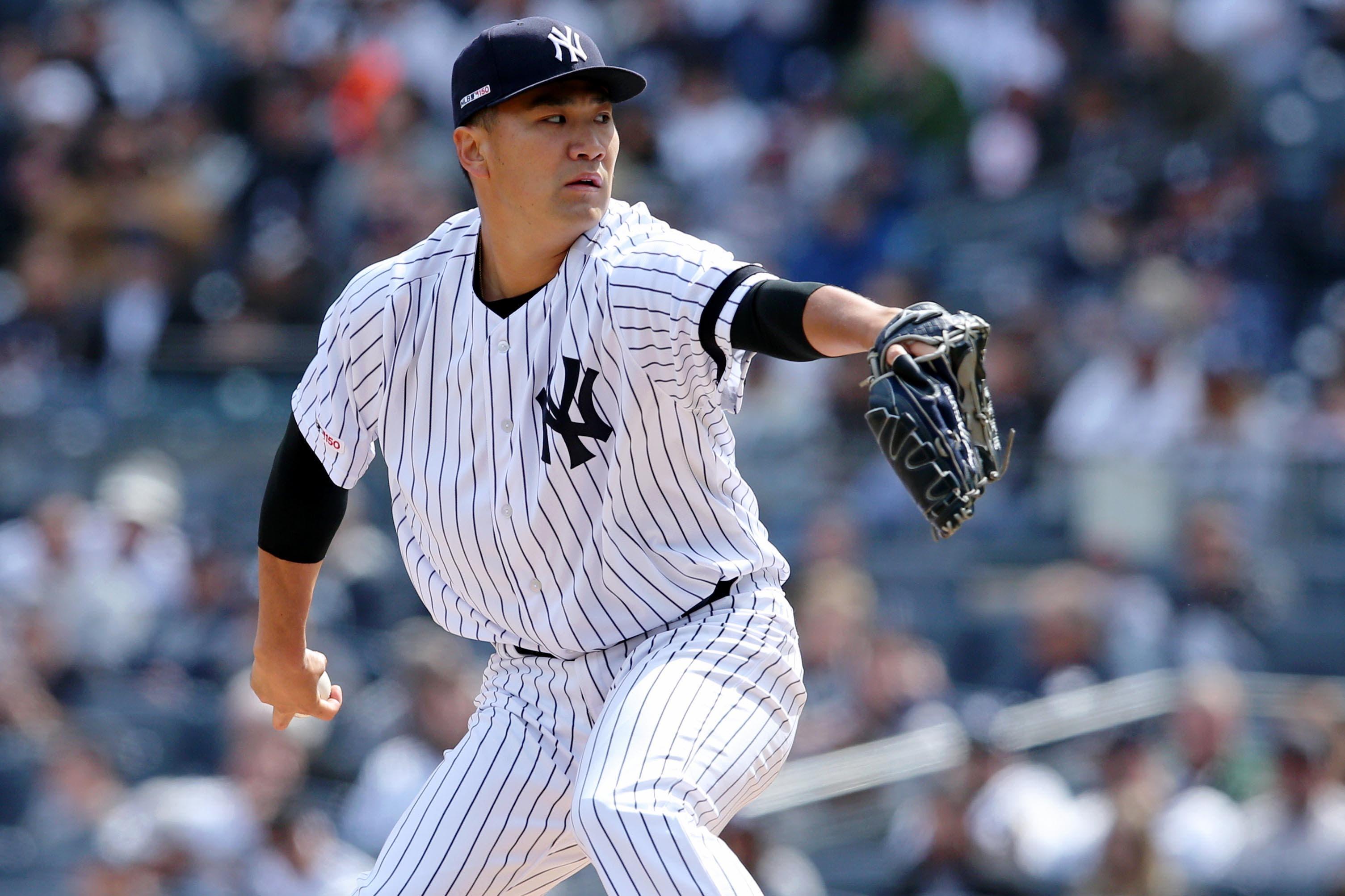 Mar 28, 2019; Bronx, NY, USA; New York Yankees starting pitcher Masahiro Tanaka (19) pitches against the Baltimore Orioles during the second inning at Yankee Stadium. Mandatory Credit: Brad Penner-USA TODAY Sports / Brad Penner