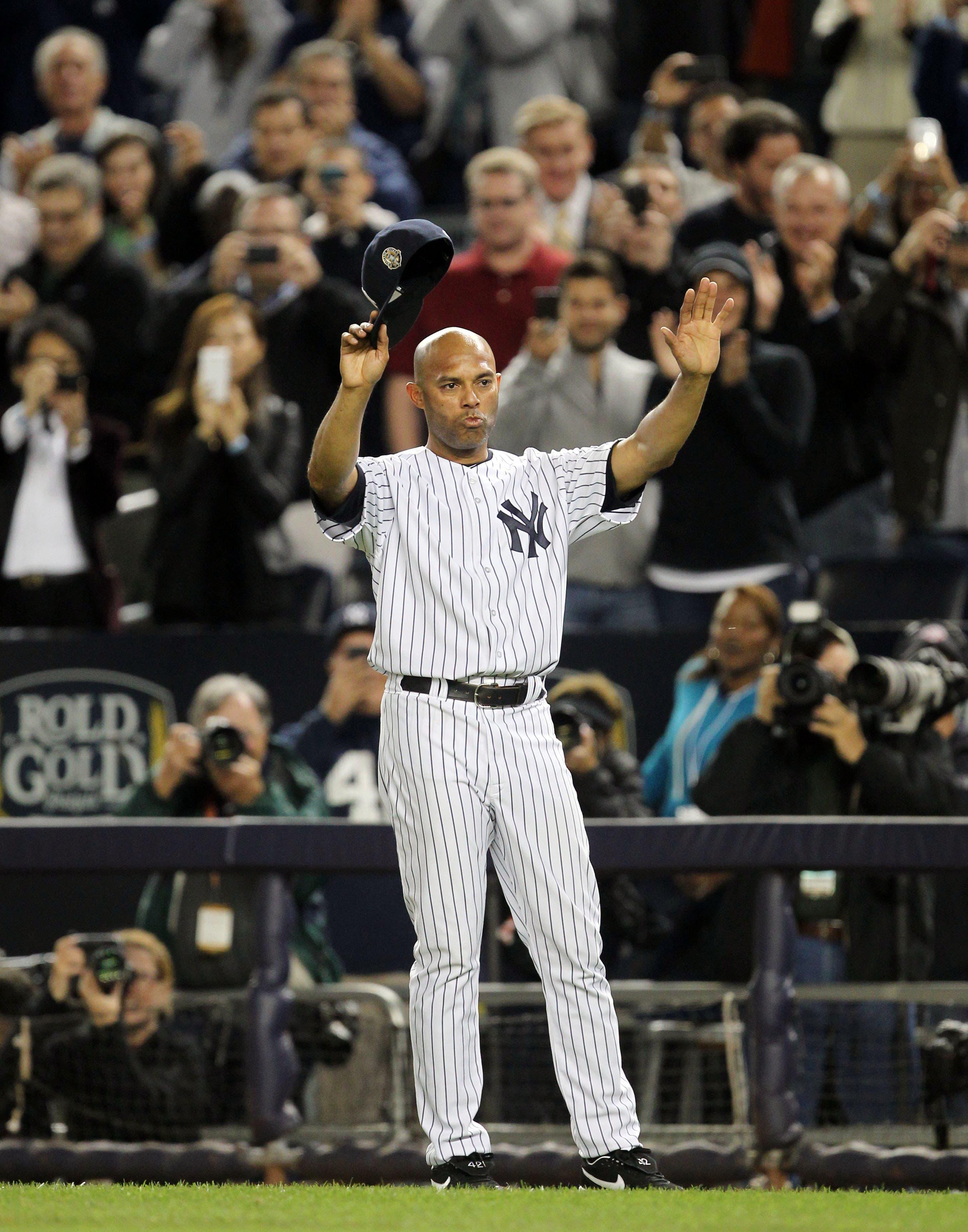 New York Yankees relief pitcher Mariano Rivera waves to the fans after the game against the Tampa Bay Rays at Yankee Stadium. / John Munson/The Star-Ledger-USA TODAY Sports