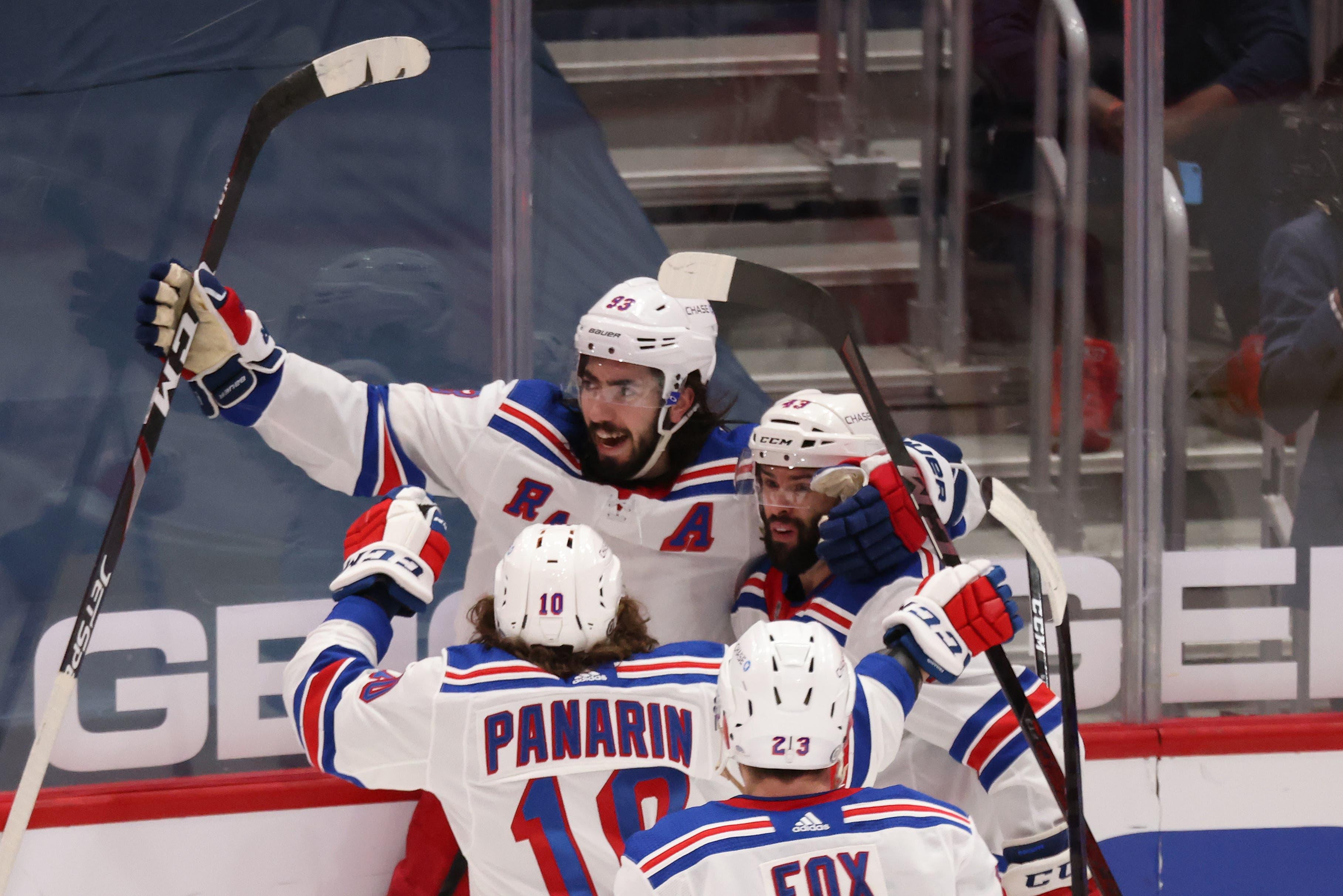 Mar 20, 2021; Washington, District of Columbia, USA; New York Rangers center Mika Zibanejad (93) celebrates with teammates after scoring the go ahead goal against the Washington Capitals late in the third period at Capital One Arena. Mandatory Credit: Geoff Burke-USA TODAY Sports / Geoff Burke-USA TODAY Sports