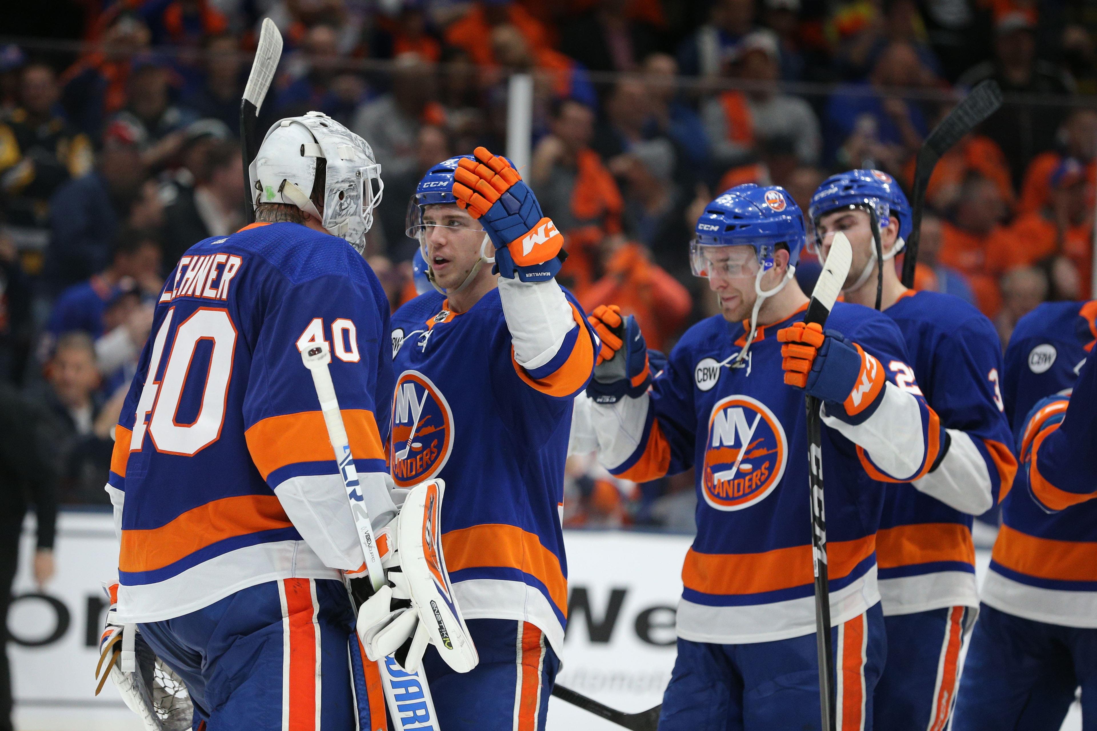 Apr 12, 2019; Uniondale, NY, USA; New York Islanders left wing Anthony Beauvillier (18) celebrates with goalie Robin Lehner (40) after defeating the Pittsburgh Penguins in game two of the first round of the 2019 Stanley Cup Playoffs at Nassau Veterans Memorial Coliseum. Mandatory Credit: Brad Penner-USA TODAY Sports / Brad Penner