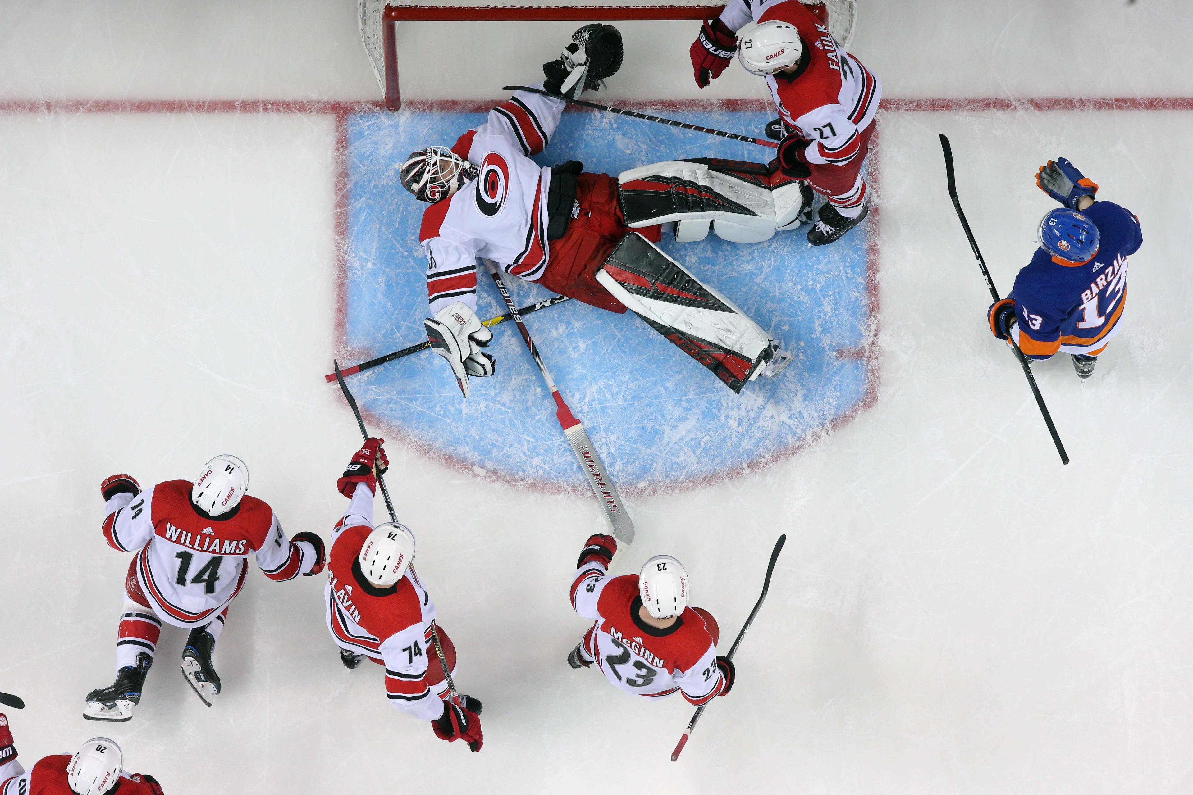 Carolina Hurricanes goalie Curtis McElhinney reacts after making a save against New York Islanders center Mathew Barzal during the third period of Game 2 of the second round of the 2019 Stanley Cup Playoffs at Barclays Center.