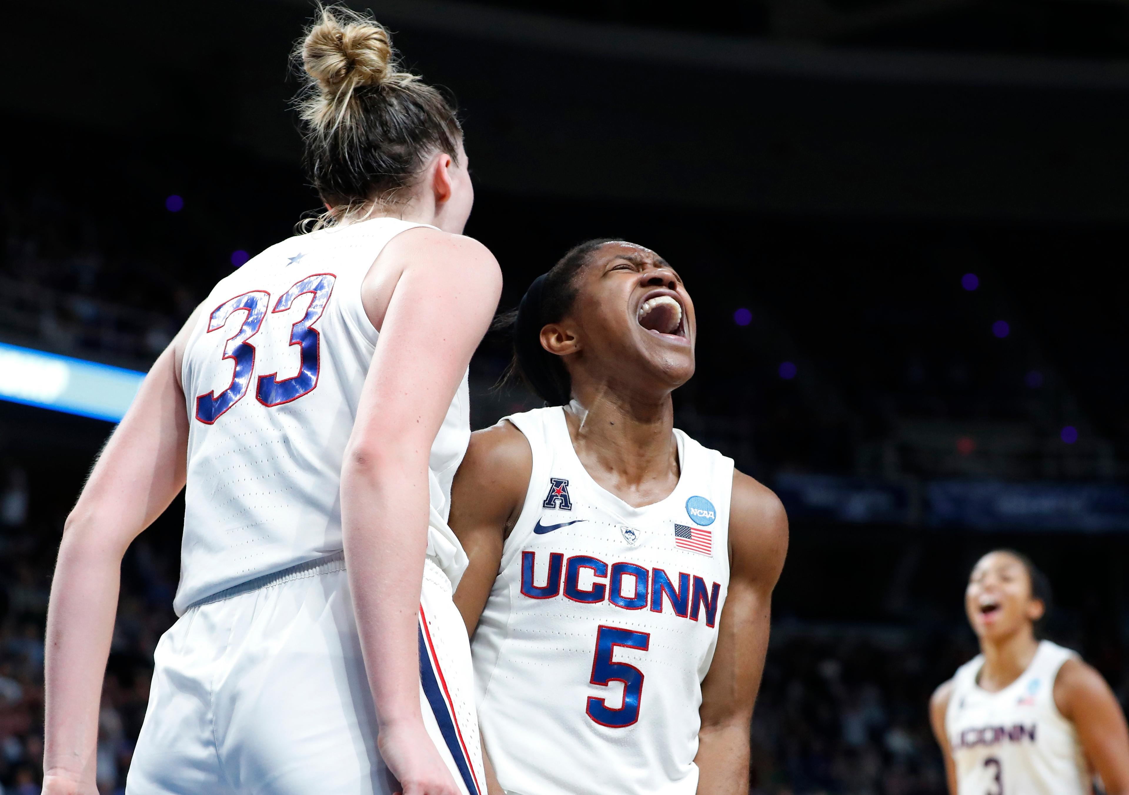 Mar 29, 2019; Albany , NY, USA; UConn Huskies guard Crystal Dangerfield (5) reacts to a basket and foul by guard Katie Lou Samuelson (33) against the UCLA Bruins during the second half in the semifinals of the Albany regional in the women's 2019 NCAA Tournament at the Times Union Center. Mandatory Credit: Rich Barnes-USA TODAY Sports 