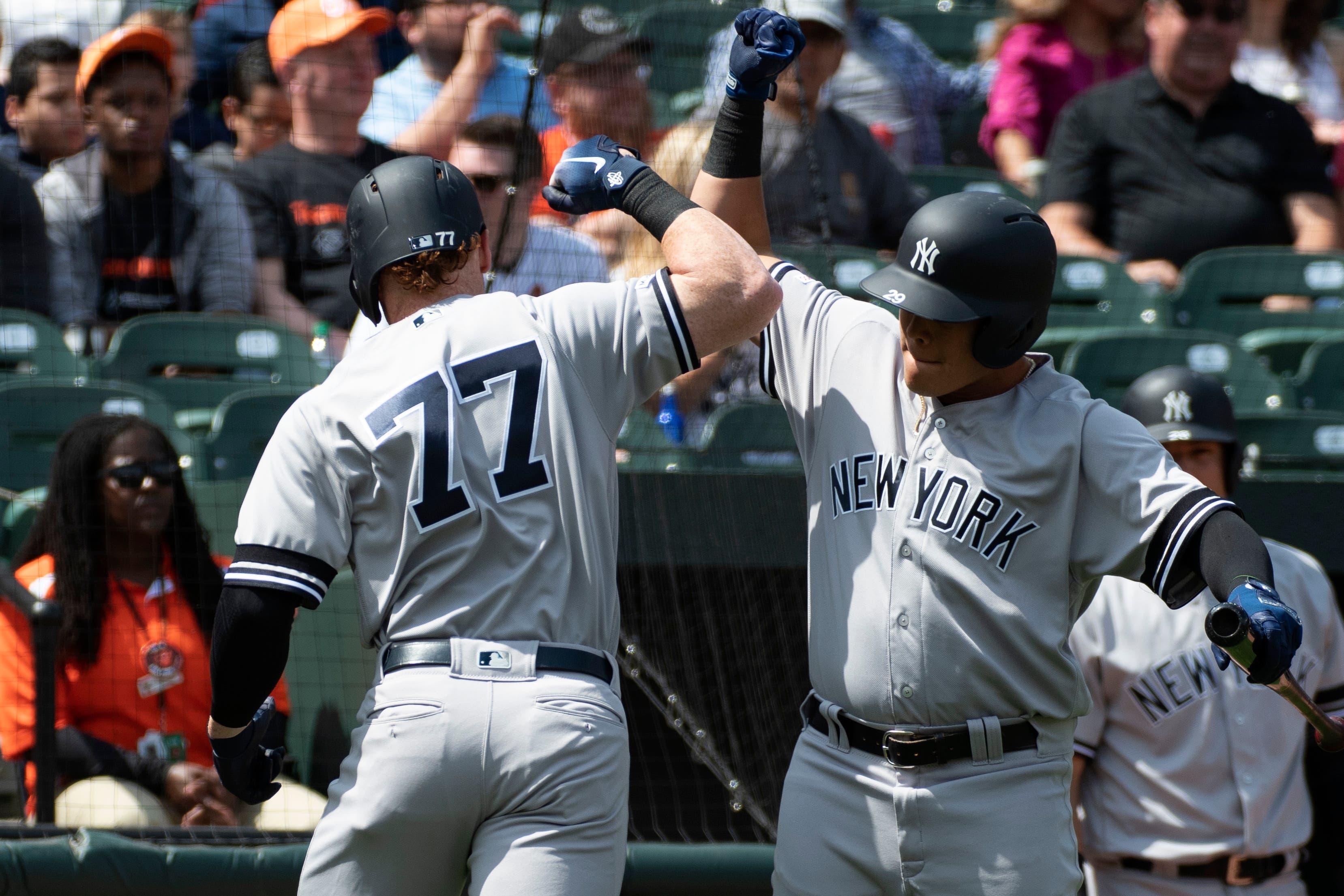 Apr 7, 2019; Baltimore, MD, USA; New York Yankees left fielder Clint Frazier (77) celebrates with third baseman Gio Urshela (29) after his second inning solo home run against the Baltimore Orioles at Oriole Park at Camden Yards. Mandatory Credit: Tommy Gilligan-USA TODAY Sports / Tommy Gilligan