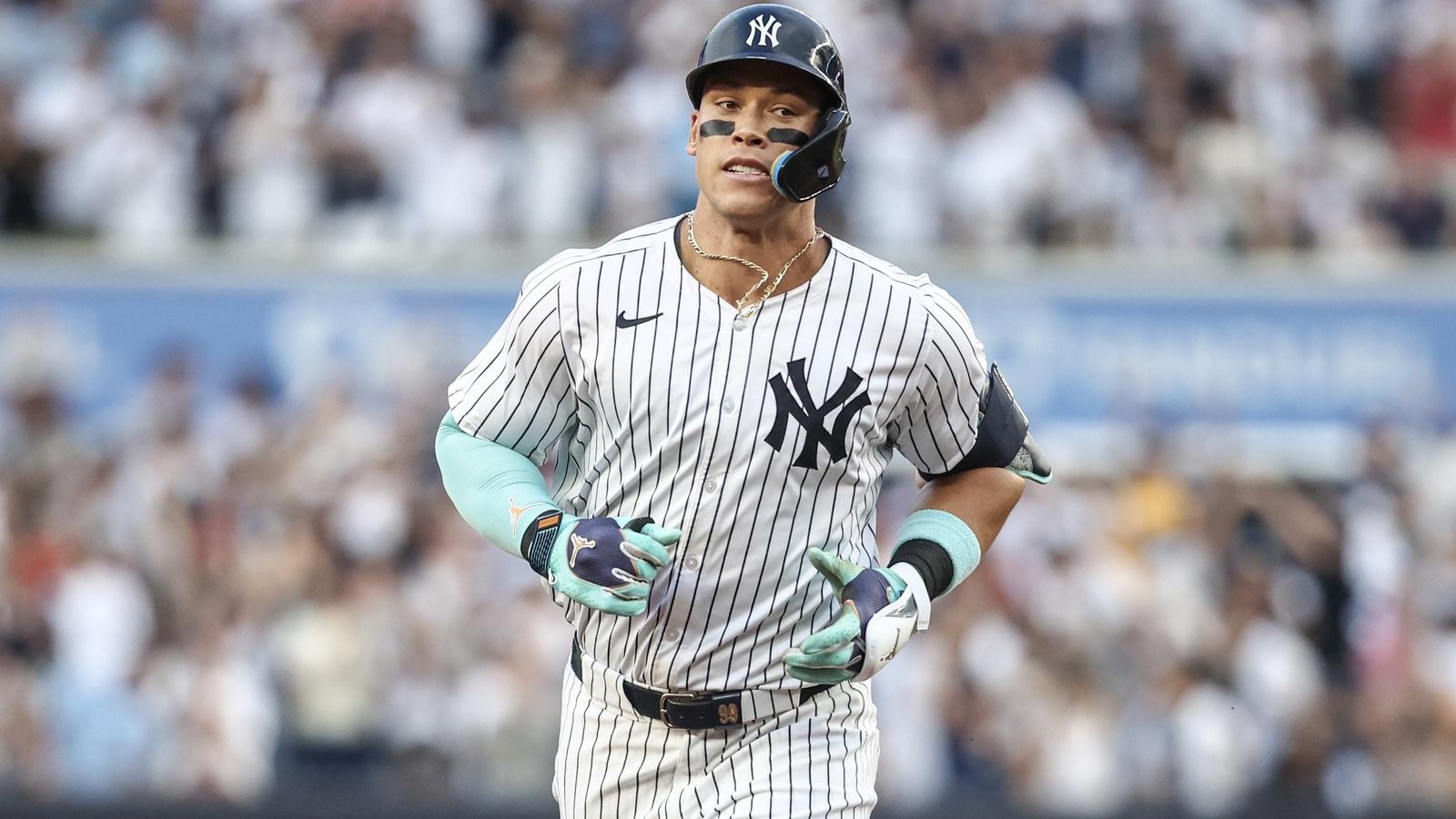 New York Yankees center fielder Aaron Judge (99) runs the bases after hitting a two run home run against the Atlanta Braves in the first inning at Yankee Stadium.