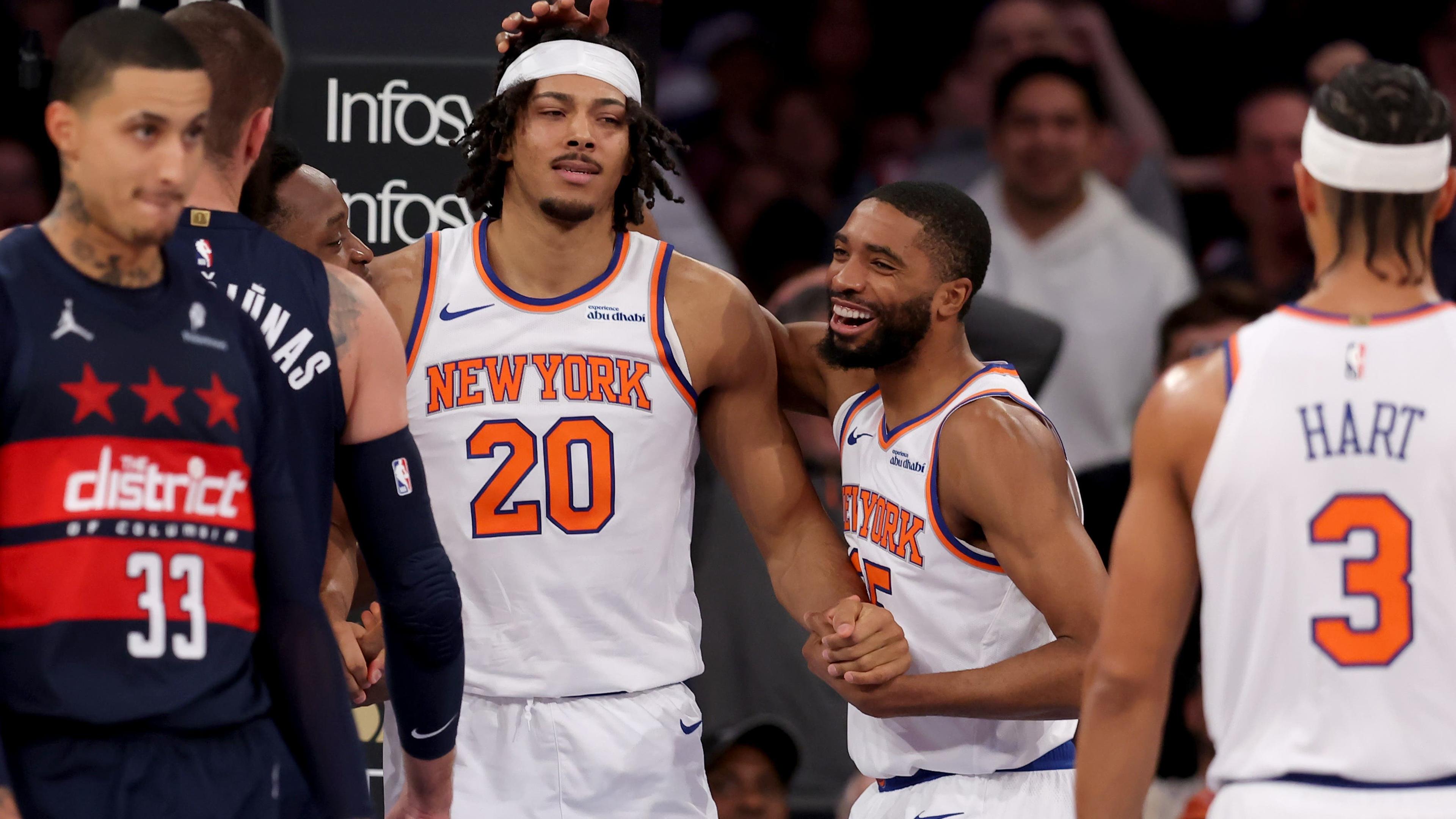 New York Knicks forward Mikal Bridges (25) reacts after a dunk by center Jericho Sims (20) against the Washington Wizards during the second quarter at Madison Square Garden / Brad Penner - Imagn Images