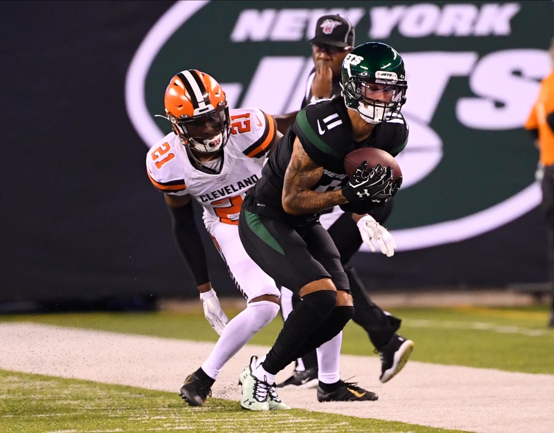 Sep 16, 2019; East Rutherford, NJ, USA; New York Jets wide receiver Robby Anderson (11) makes a catch in front of Cleveland Browns cornerback Denzel Ward (21) in the second half at MetLife Stadium. Mandatory Credit: Robert Deutsch-USA TODAY Sports