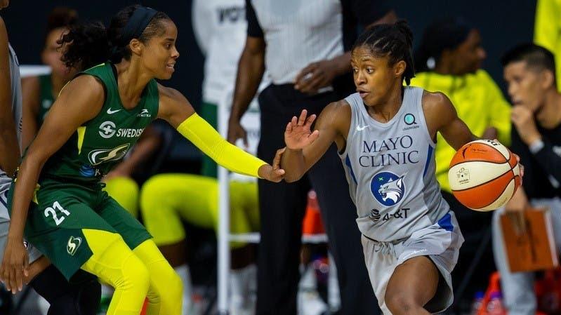 Sep 24, 2020; Bradenton, Florida, USA; Minnesota Lynx guard Crystal Dangerfield (2) dribbles past Seattle Storm guard Jordin Canada (21) during Game 2 of the WNBA Semifinals at Feld Entertainment. / Mary Holt-USA TODAY Sports