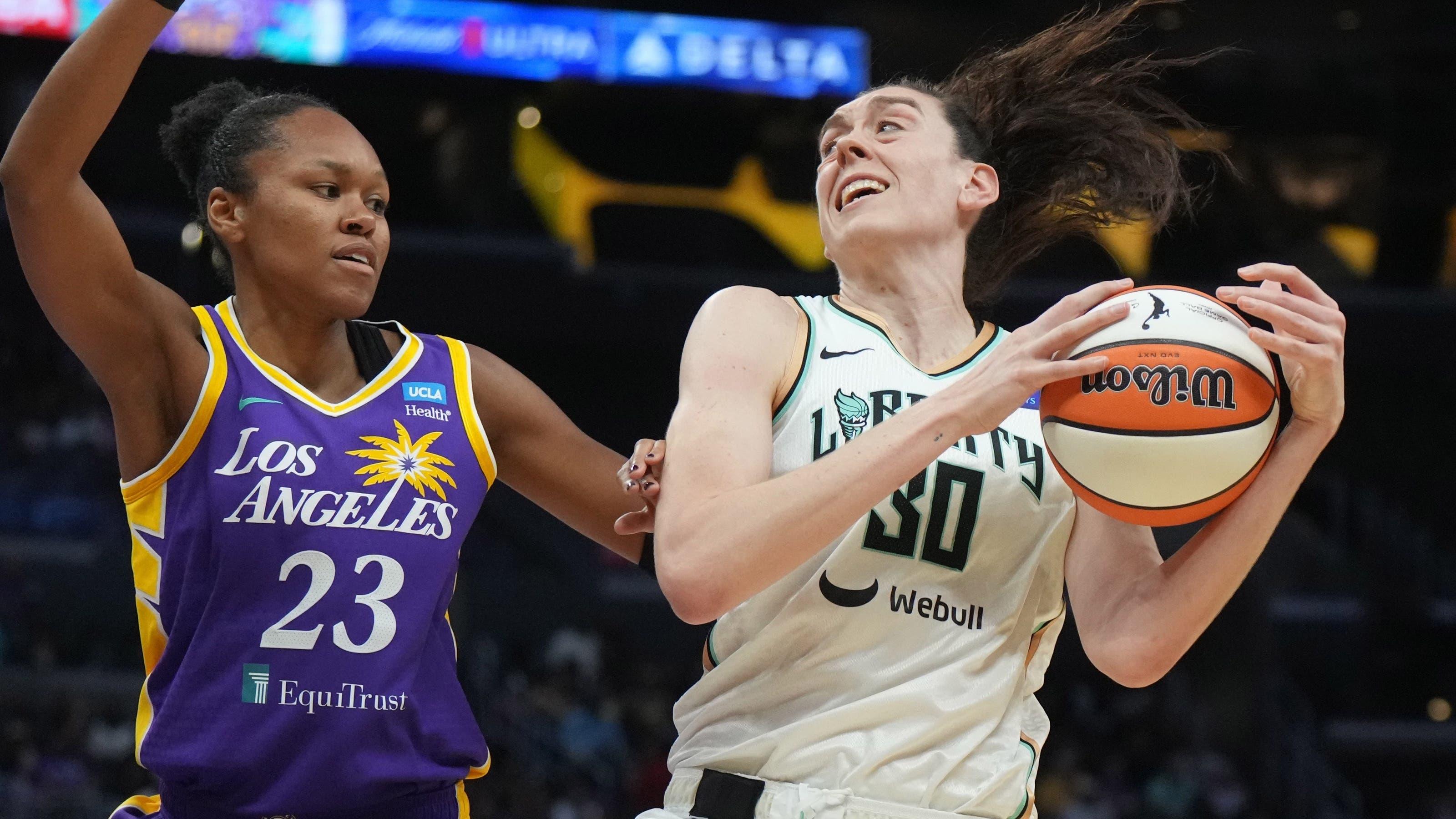 New York Liberty forward Breanna Stewart (30) is defended by LA Sparks forward Azura Stevens (23) in the first half at Crypto.com Arena. / Kirby Lee-USA TODAY Sports