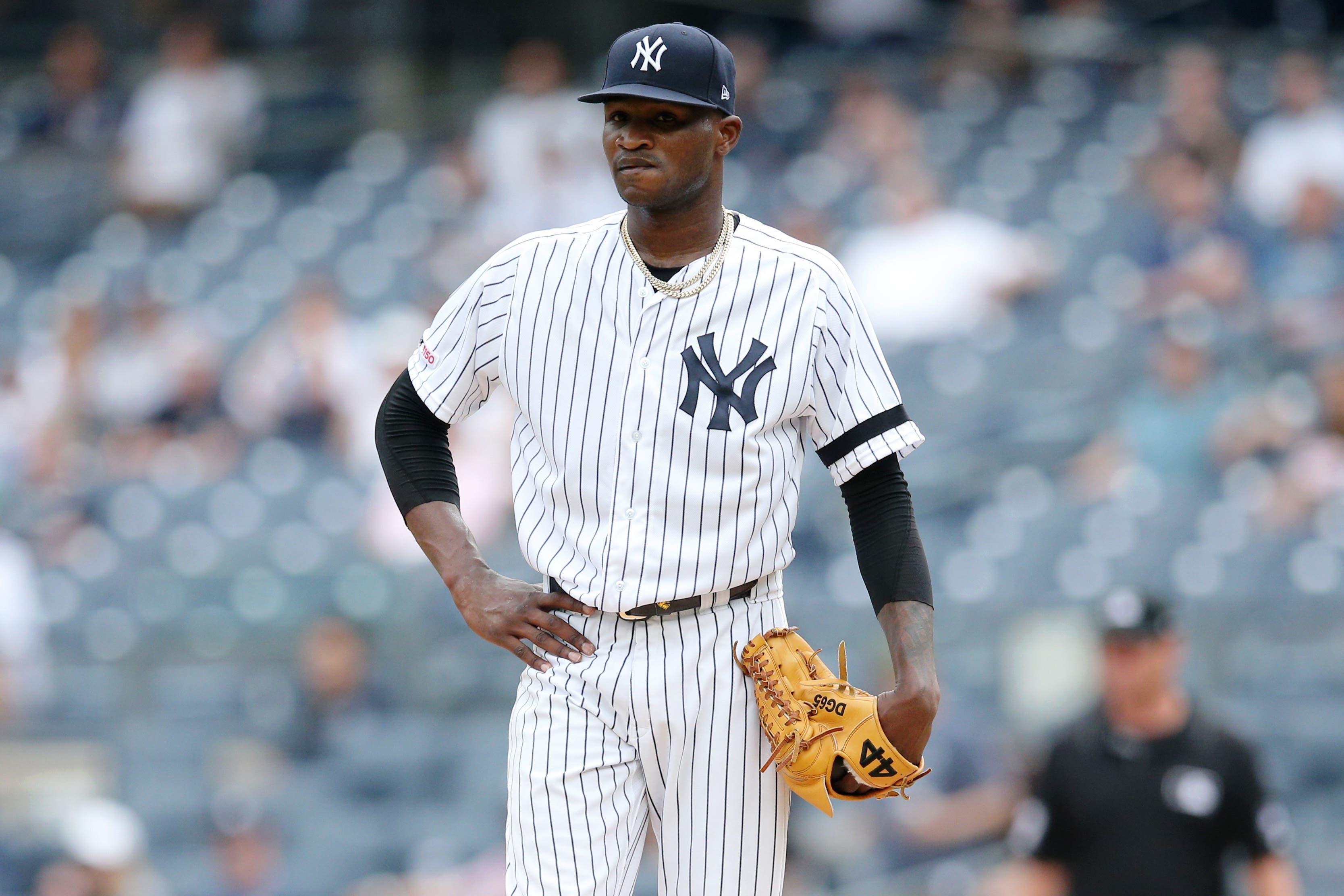 Jul 18, 2019; Bronx, NY, USA; New York Yankees starting pitcher Domingo German (55) reacts after allowing a solo home run to Tampa Bay Rays third baseman Yandy Diaz (not pictured) during the first inning of the first game of a doubleheader at Yankee Stadium. Mandatory Credit: Brad Penner-USA TODAY Sports / Brad Penner