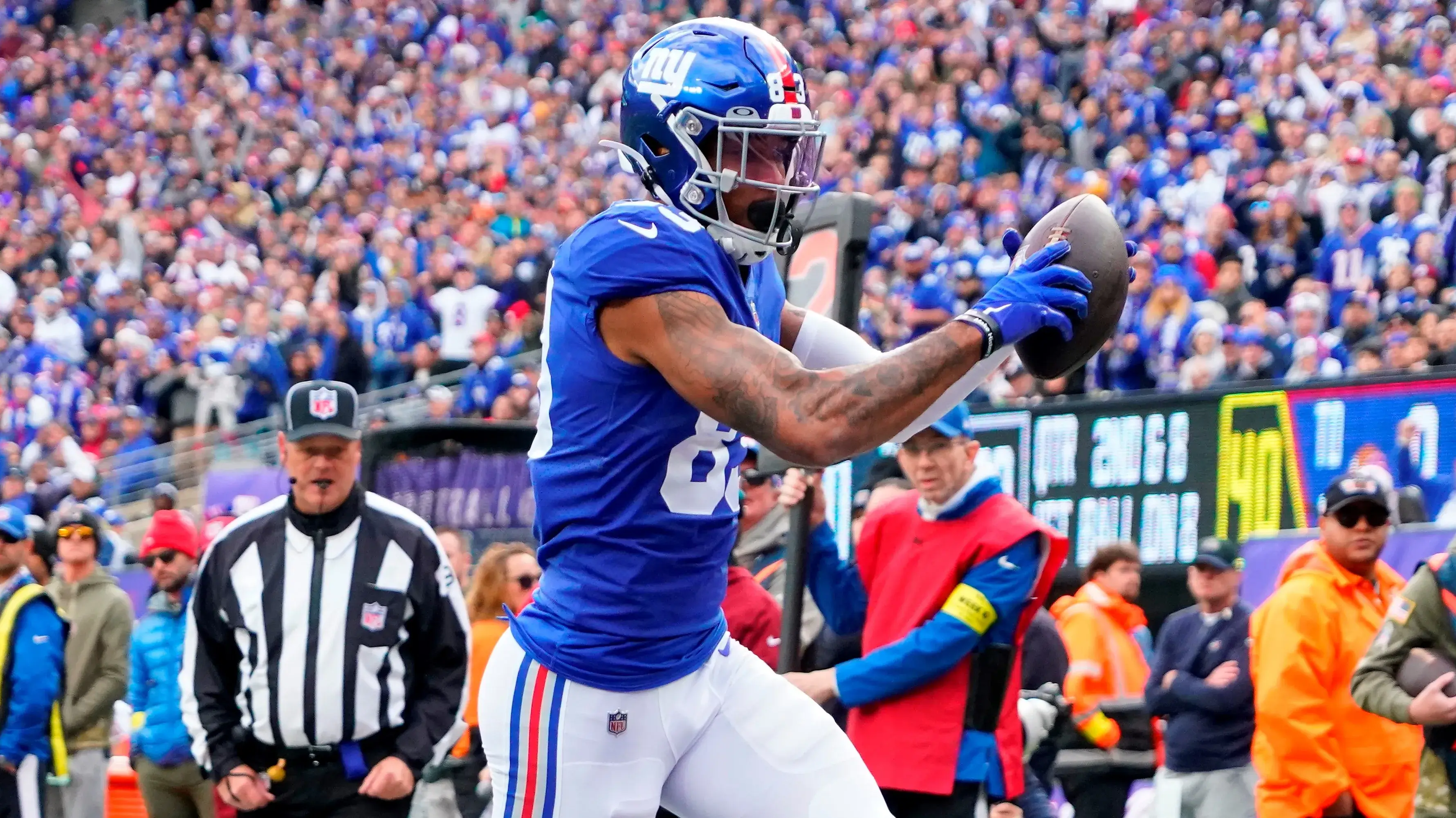 Nov 13, 2022; East Rutherford, NJ, USA; New York Giants tight end Lawrence Cager (83) scores a touchdown as Houston Texans safety Jalen Pitre (5) defends during the first quarter at MetLife Stadium. Mandatory Credit: Robert Deutsch-USA TODAY Sports / © Robert Deutsch-USA TODAY Sports