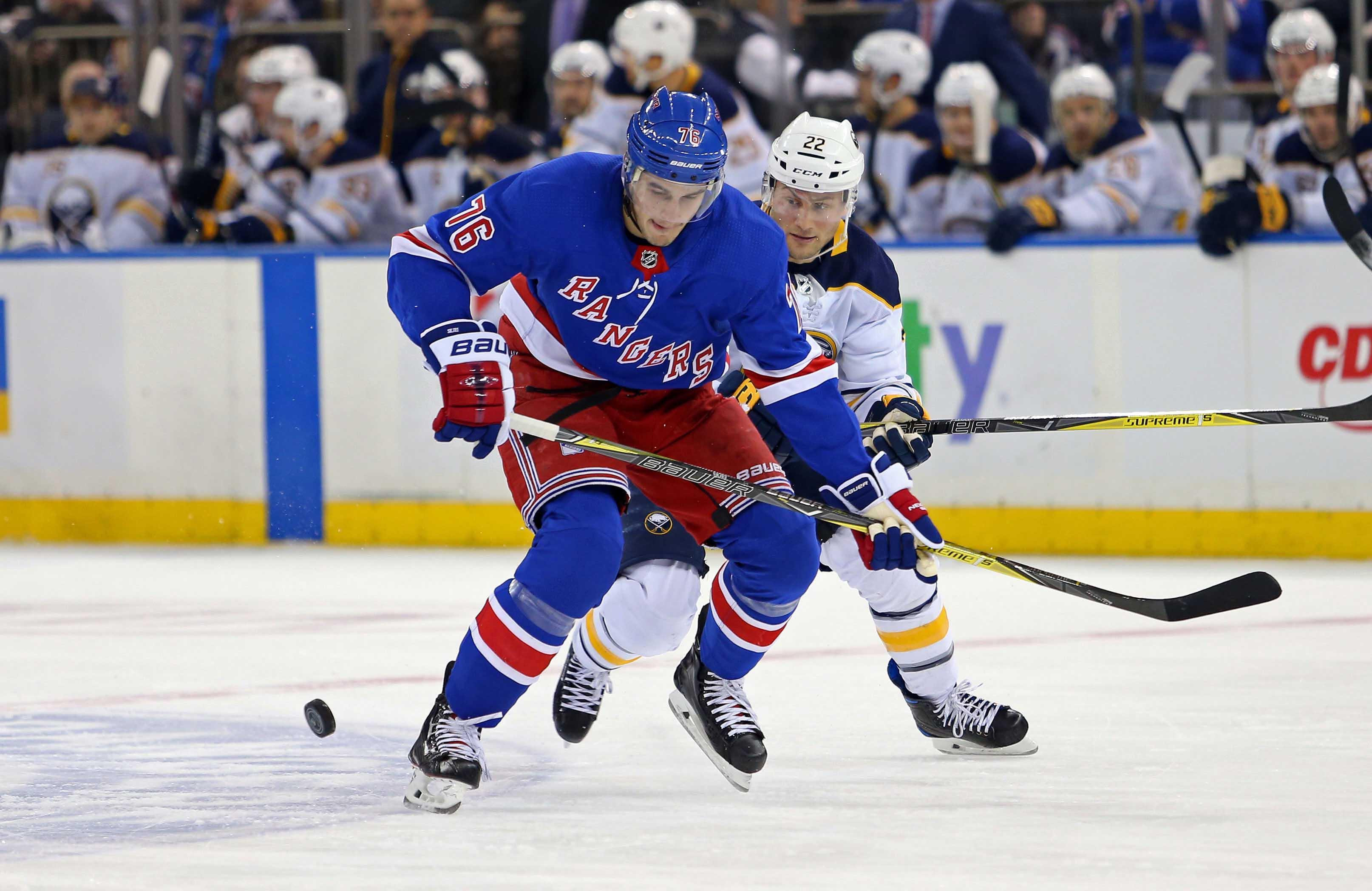 Mar 24, 2018; New York, NY, USA; New York Rangers defenseman Brady Skjei (76) and Buffalo Sabres left wing Johan Larsson (22) battle for the puck during the first period at Madison Square Garden. Mandatory Credit: Danny Wild-USA TODAY Sports / Danny Wild