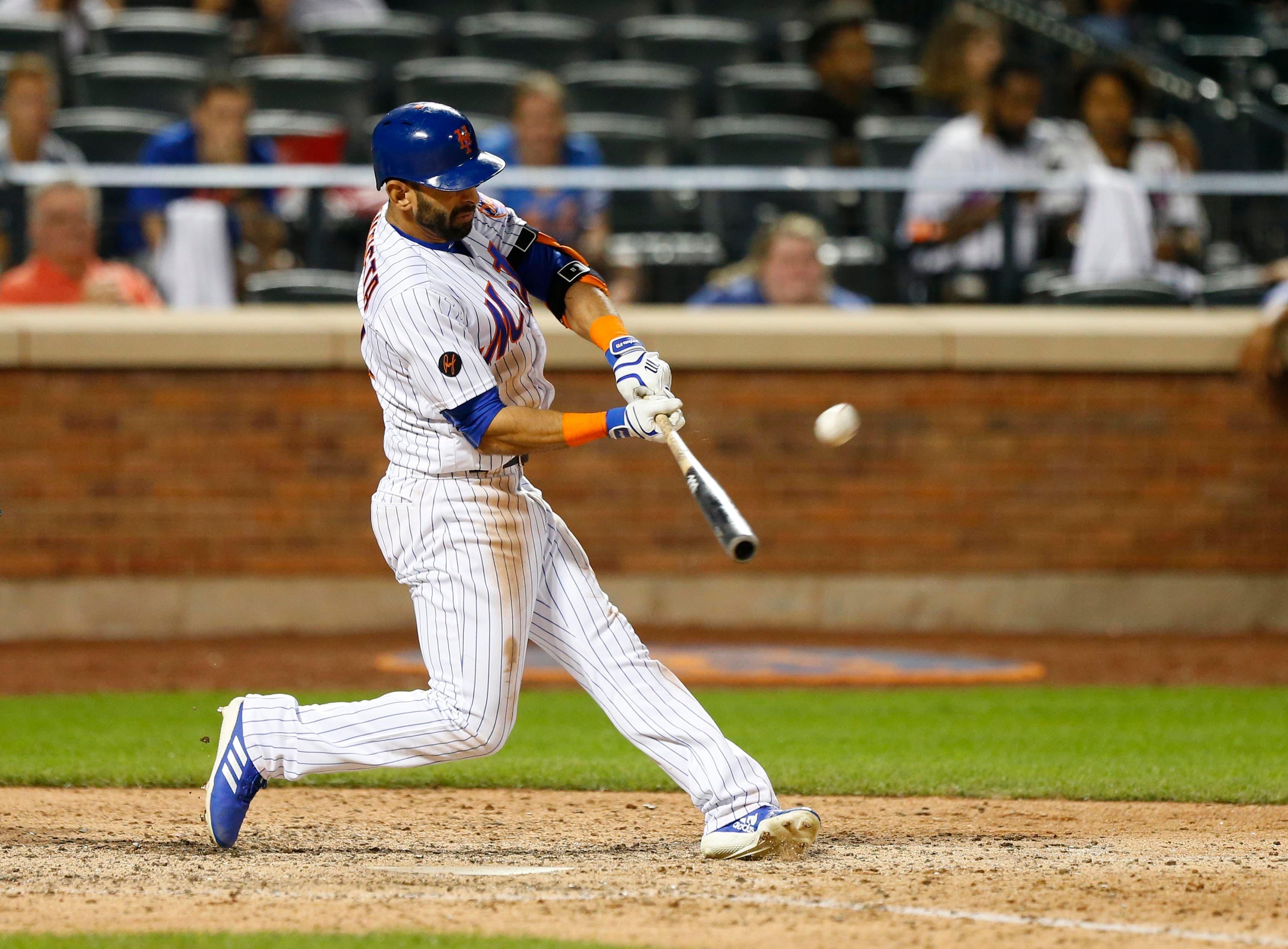 Jul 6, 2018; New York City, NY, USA; New York Mets right fielder Jose Bautista (11) hits a game winning grand slam in the ninth inning against the Tampa Bay Rays at Citi Field. Mandatory Credit: Noah K. Murray-USA TODAY Sports / Noah K. Murray