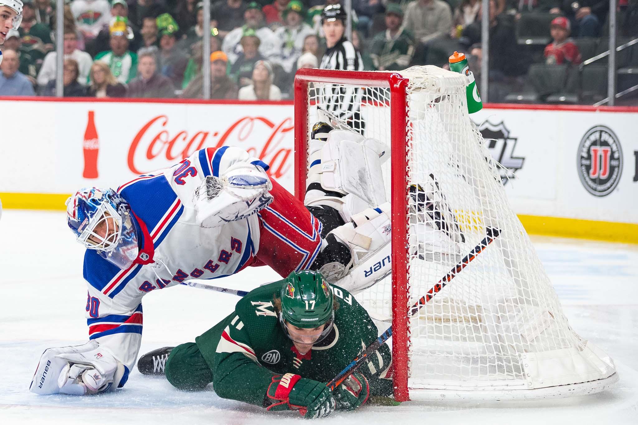 Mar 16, 2019; Saint Paul, MN, USA; Minnesota Wild left wing Marcus Foligno (17) slides into New York Rangers goaltender Henrik Lundqvist (30) during the first period at Xcel Energy Center. Mandatory Credit: Harrison Barden-USA TODAY Sports / Harrison Barden