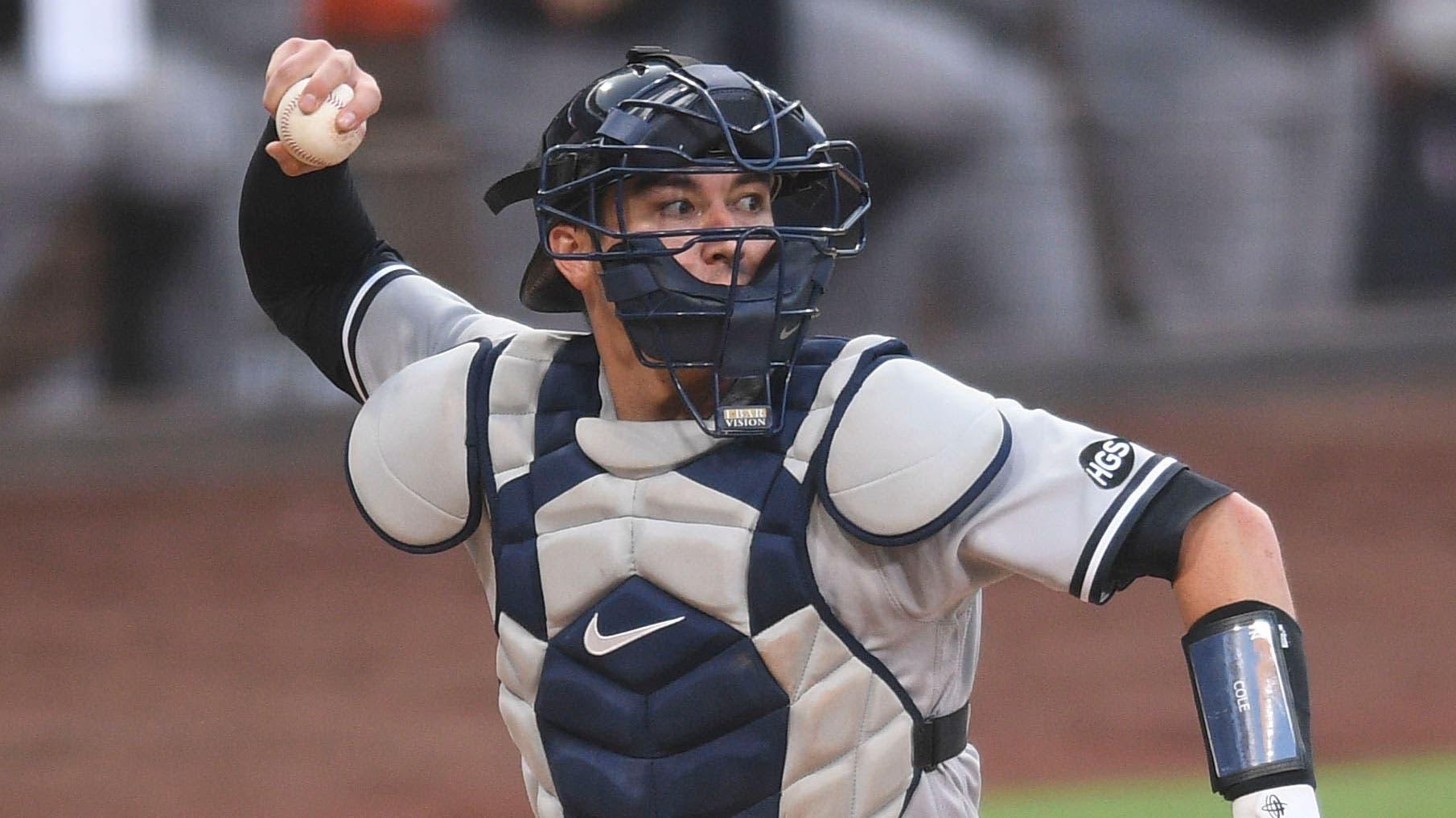 Oct 5, 2020; San Diego, California, USA; New York Yankees catcher Kyle Higashioka (66) throws to first base for an out against Tampa Bay Rays catcher Mike Zunino (not pictured) during the third inning in game one of the 2020 ALDS at Petco Park. / Orlando Ramirez-USA TODAY Sports