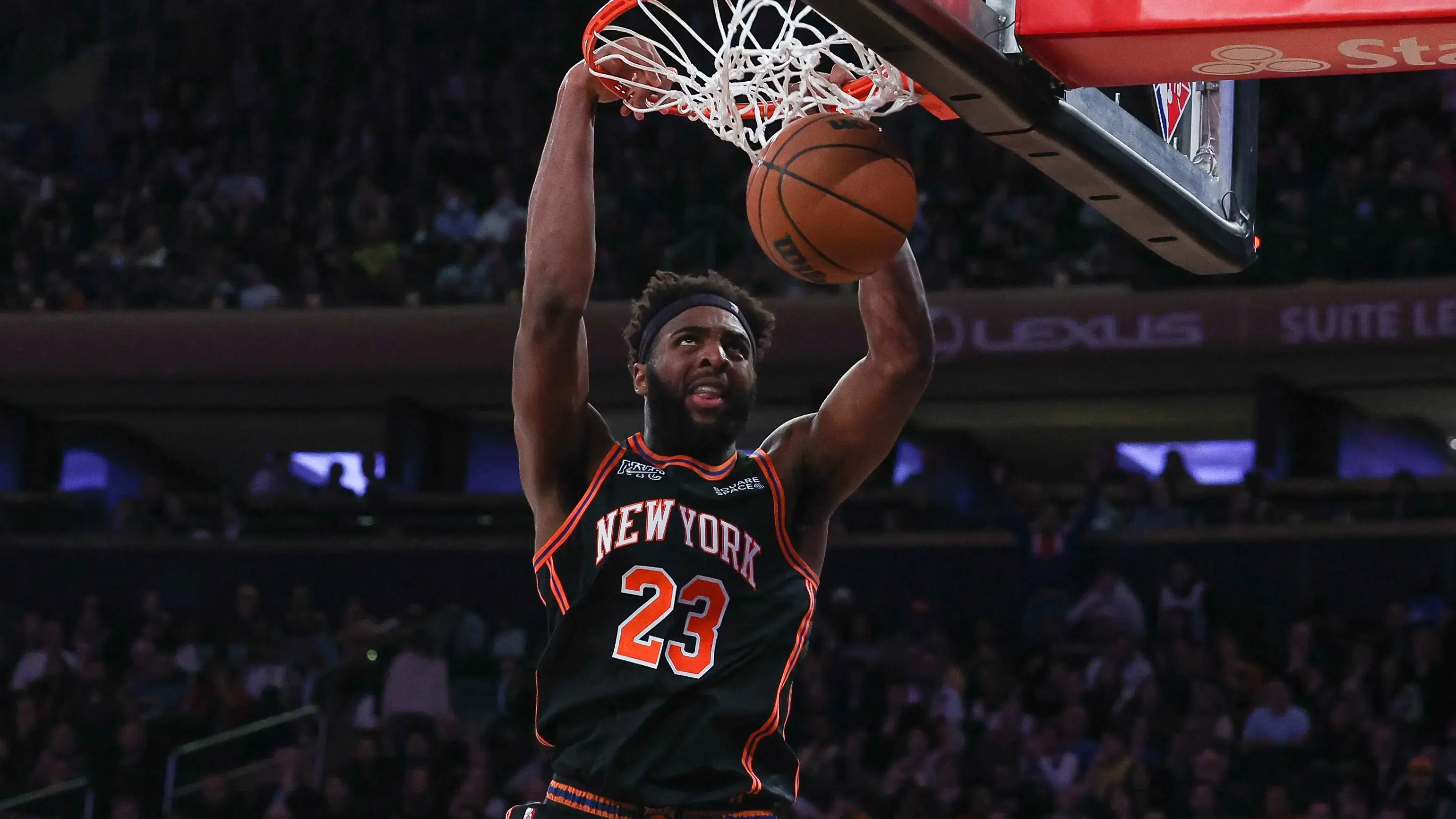 Mar 22, 2022; New York, New York, USA; New York Knicks center Mitchell Robinson (23) dunks during the second half against the Atlanta Hawks at Madison Square Garden. / Vincent Carchietta-USA TODAY Sports