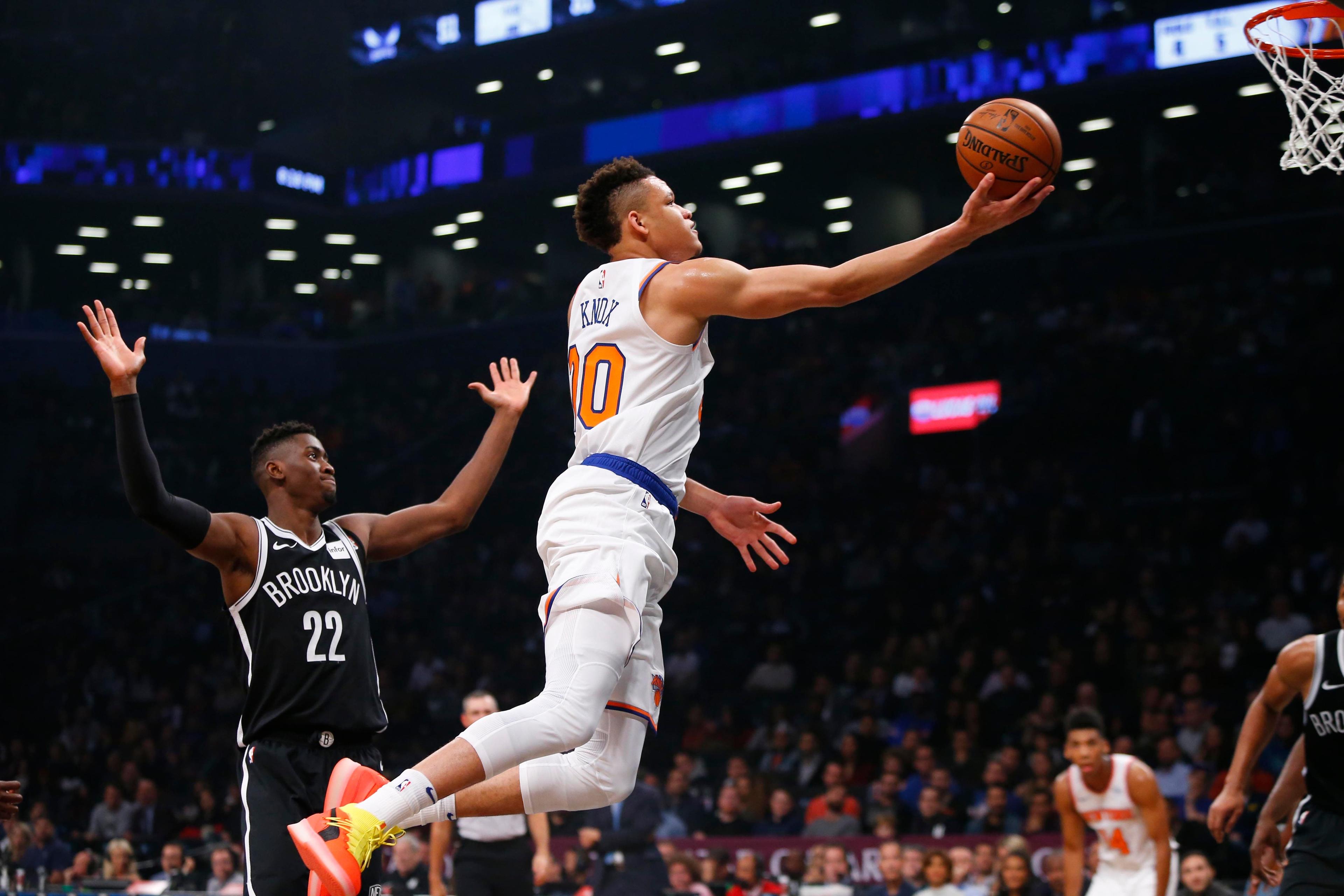 Oct 19, 2018; Brooklyn, NY, USA; New York Knicks forward Kevin Knox (20) drives to the basket against Brooklyn Nets guard Caris LeVert (22) during the first half at Barclays Center. Mandatory Credit: Noah K. Murray-USA TODAY Sports / Noah K. Murray