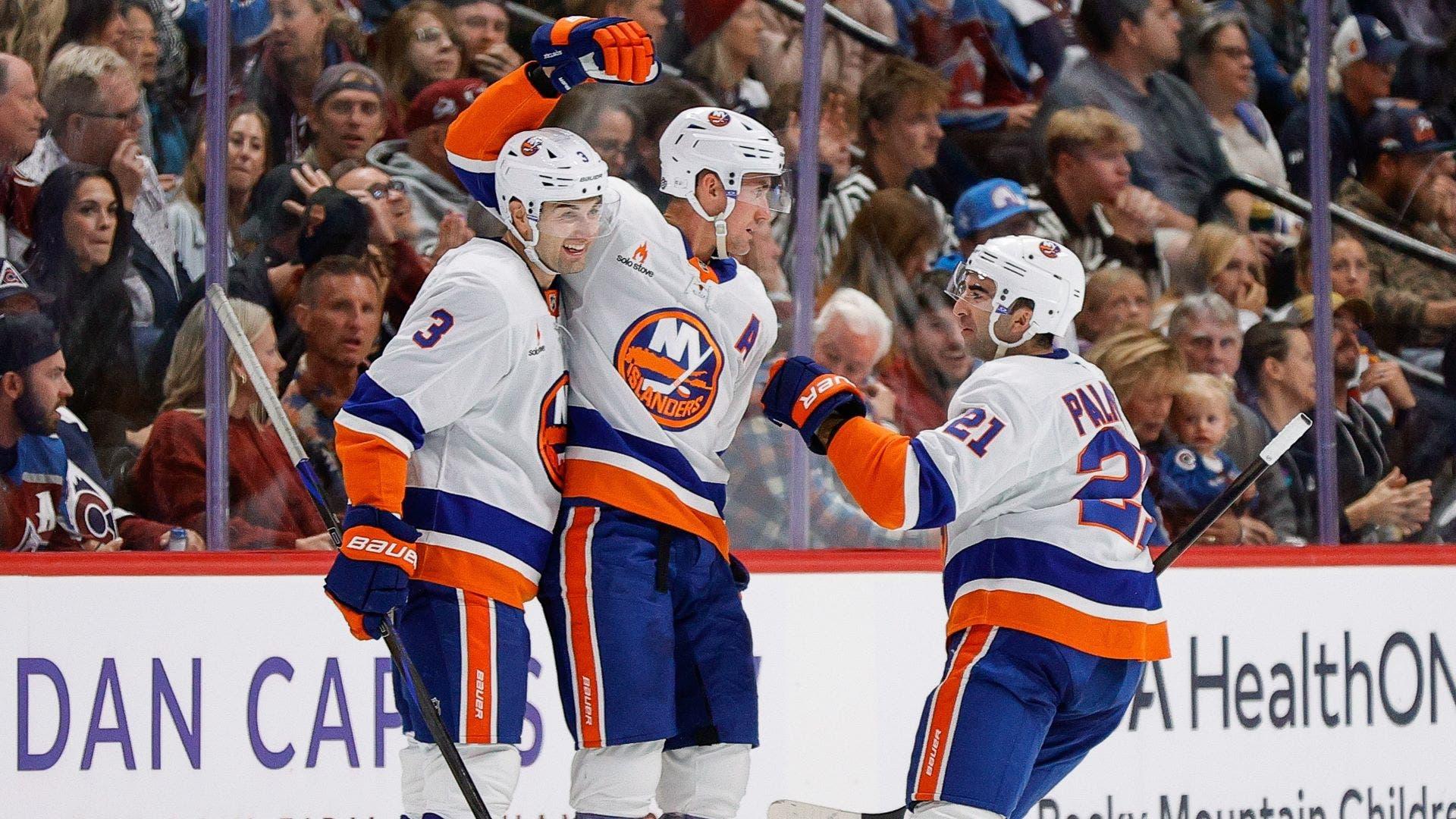 Oct 14, 2024; Denver, Colorado, USA; New York Islanders center Brock Nelson (29) celebrates his goal with defenseman Adam Pelech (3) and center Kyle Palmieri (21) in the second period against the Colorado Avalanche at Ball Arena. / Isaiah J. Downing-Imagn Images