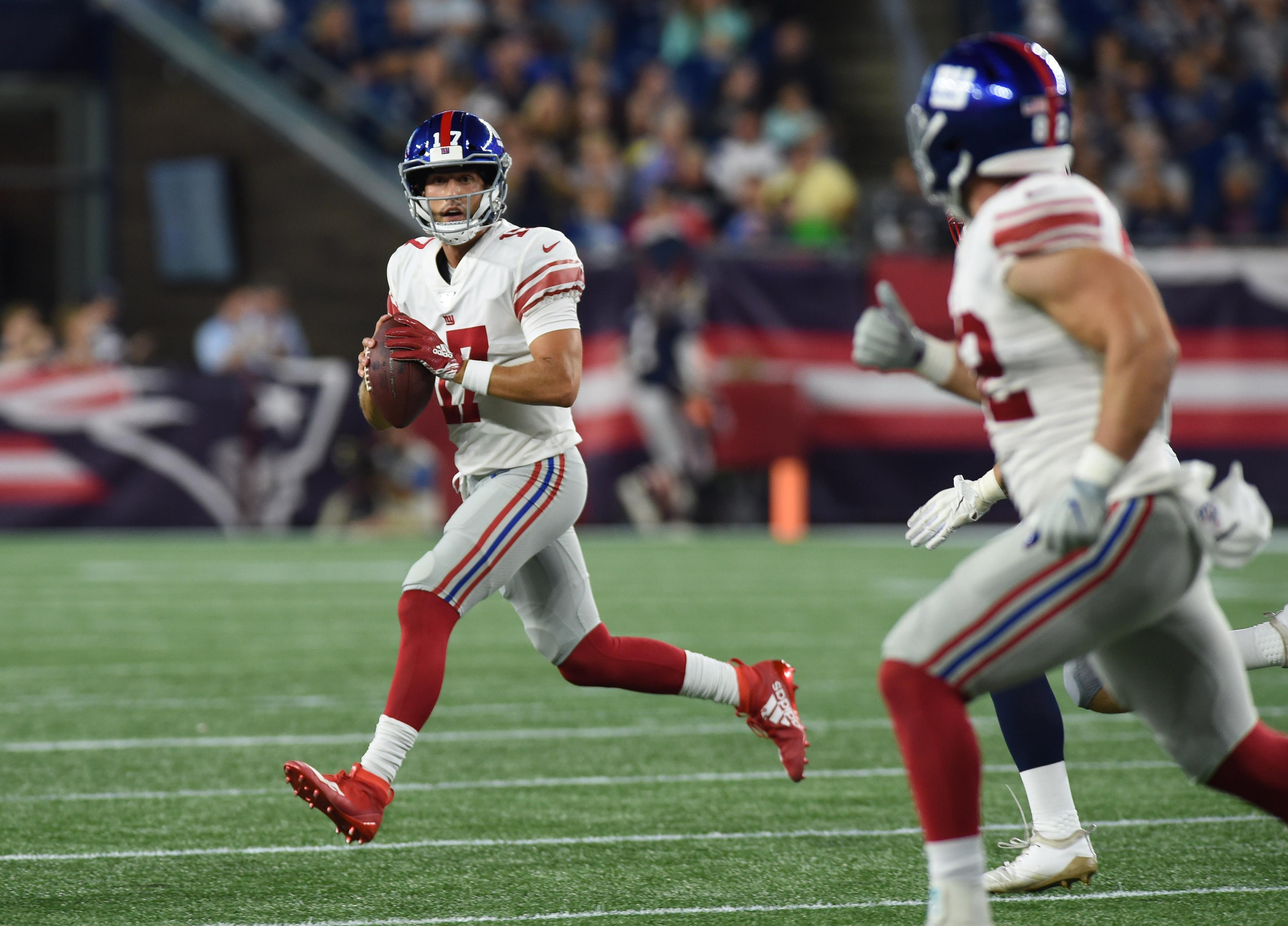 Aug 29, 2019; Foxborough, MA, USA; New York Giants quarterback Kyle Lauletta (17) rolls looks for an open receiver during the second half against the New England Patriots at Gillette Stadium. Mandatory Credit: Bob DeChiara-USA TODAY Sports