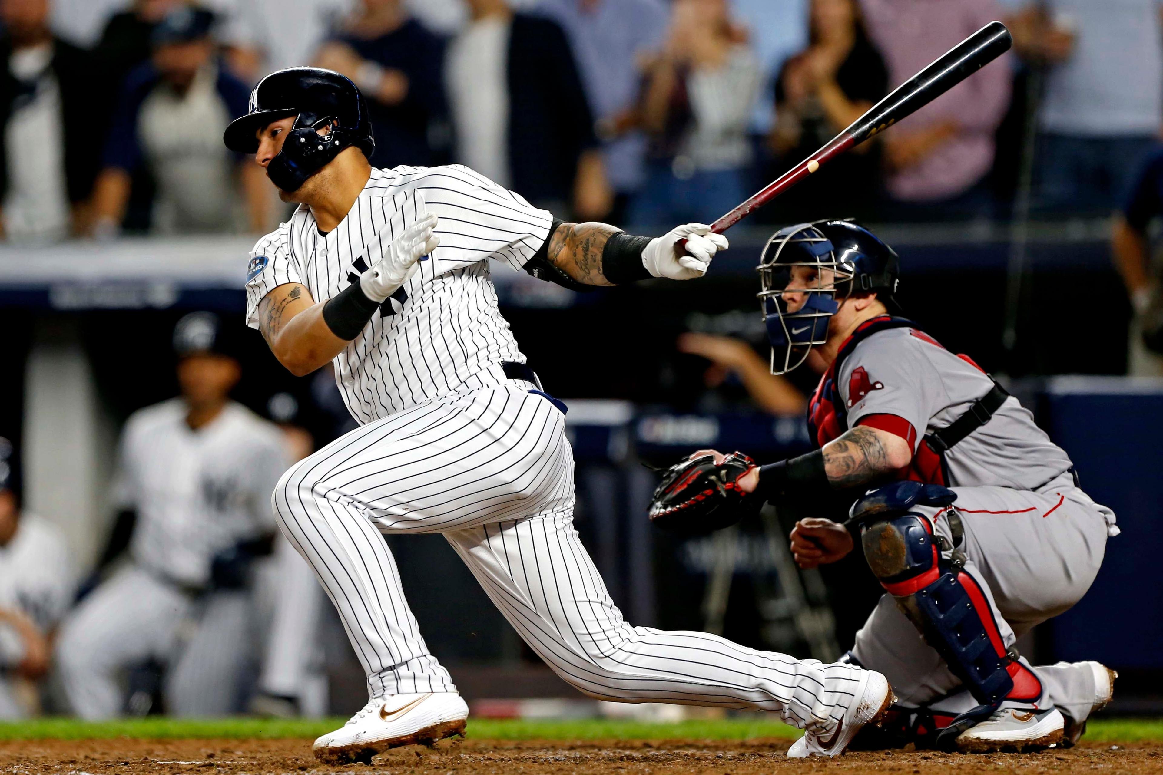 Oct 9, 2018; Bronx, NY, USA; New York Yankees second baseman Gleyber Torres (25) hits a single during the fifth inning in game four of the 2018 ALDS playoff baseball series at Yankee Stadium. Mandatory Credit: Noah K. Murray-USA TODAY Sports / Noah K. Murray