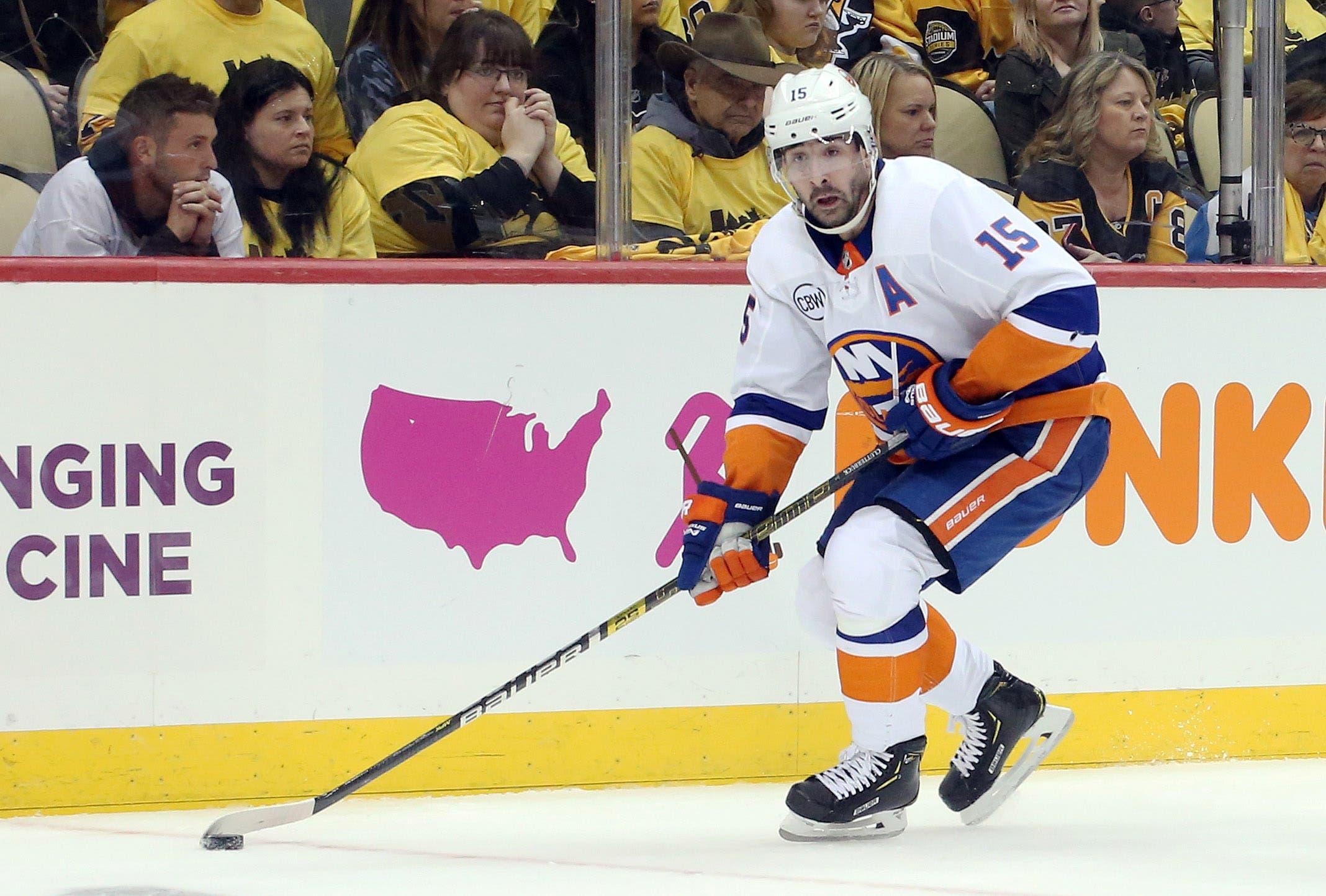 Apr 14, 2019; Pittsburgh, PA, USA; New York Islanders right wing Cal Clutterbuck (15) skates with the puck against the Pittsburgh Penguins during the third period in game three of the first round of the 2019 Stanley Cup Playoffs at PPG PAINTS Arena. The Islanders won 4-1. Mandatory Credit: Charles LeClaire-USA TODAY Sports / Charles LeClaire