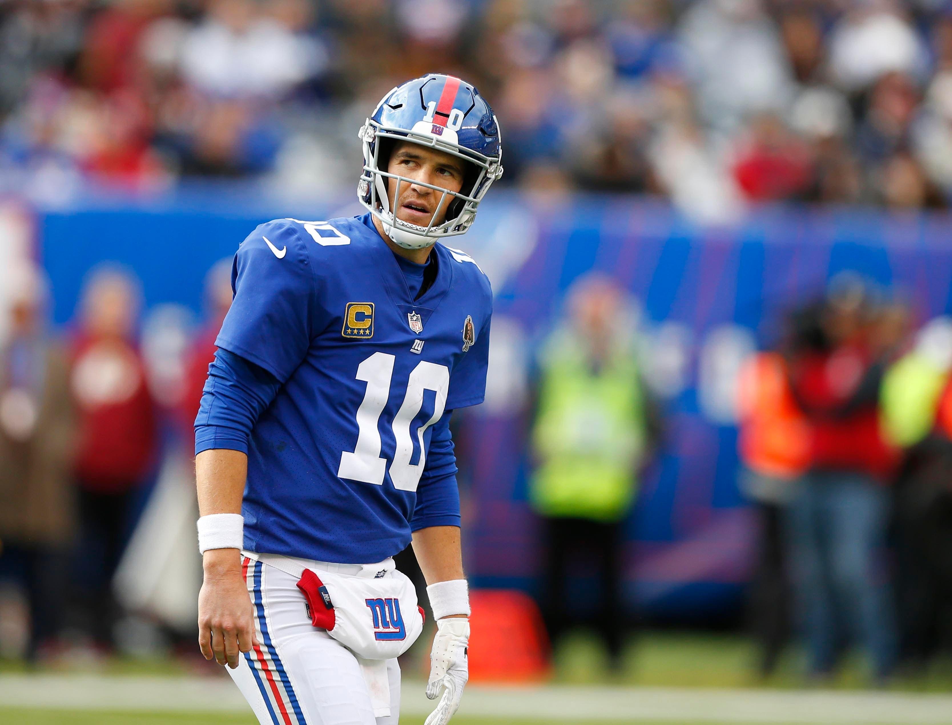 New York Giants quarterback Eli Manning reacts after being sacked by the Washington Redskins during second half at MetLife Stadium. / Noah K. Murray/USA TODAY Sports