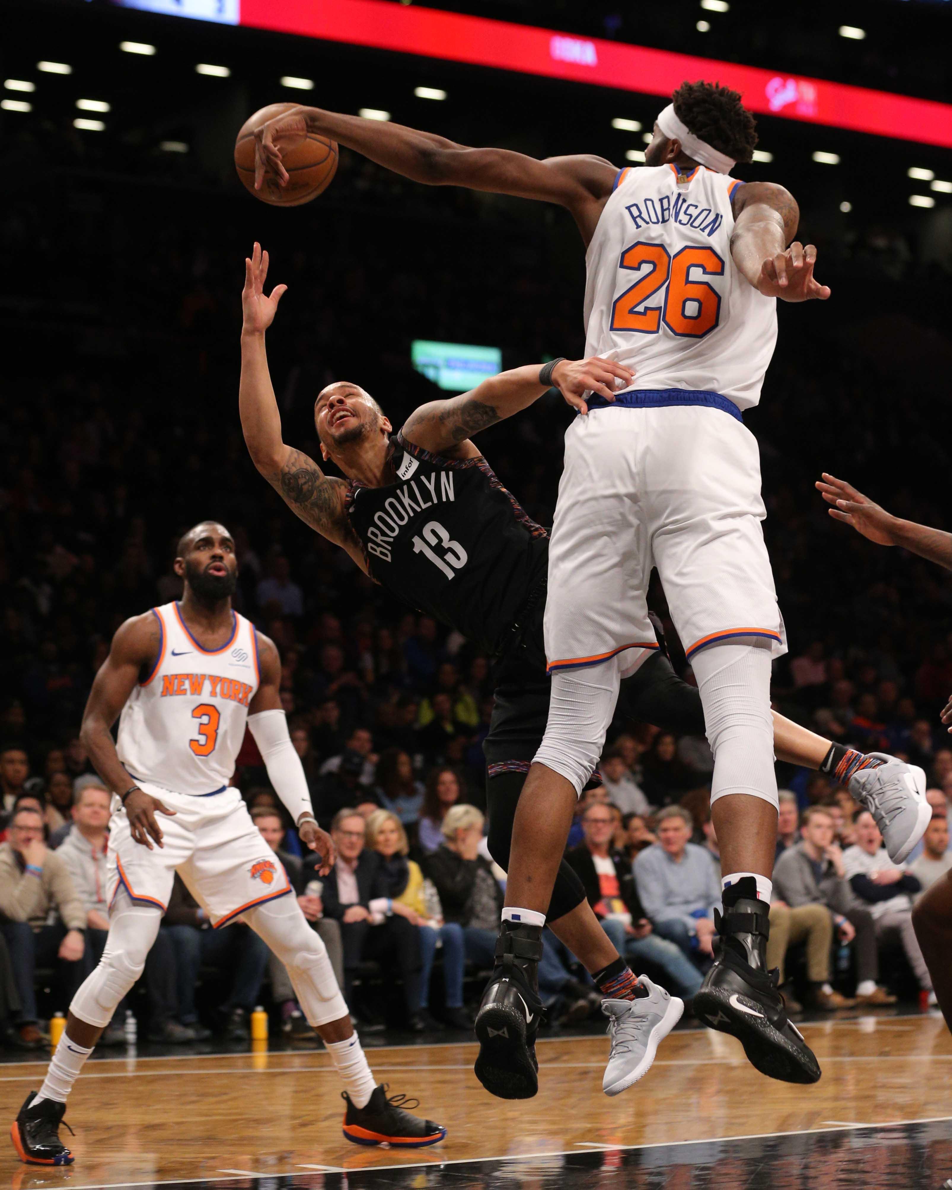 Jan 25, 2019; Brooklyn, NY, USA; New York Knicks center Mitchell Robinson (26) blocks a shot by Brooklyn Nets point guard Shabazz Napier (13) during the third quarter at Barclays Center. Mandatory Credit: Brad Penner-USA TODAY Sports / Brad Penner