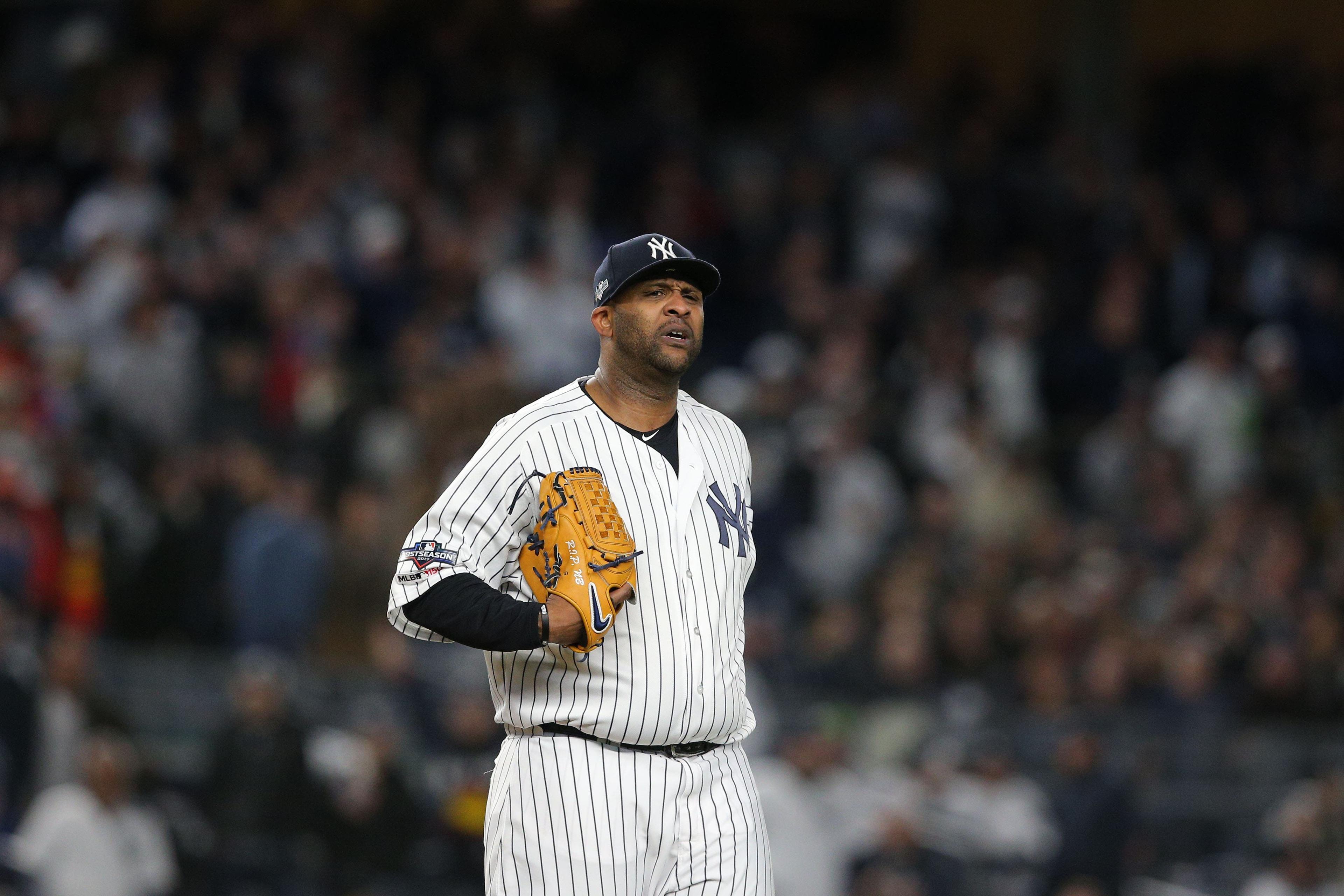 Oct 17, 2019; Bronx, NY, USA; New York Yankees starting pitcher CC Sabathia (52) reacts after an error during the eighth inning against the Houston Astros in game four of the 2019 ALCS playoff baseball series at Yankee Stadium. Mandatory Credit: Brad Penner-USA TODAY Sports / Brad Penner