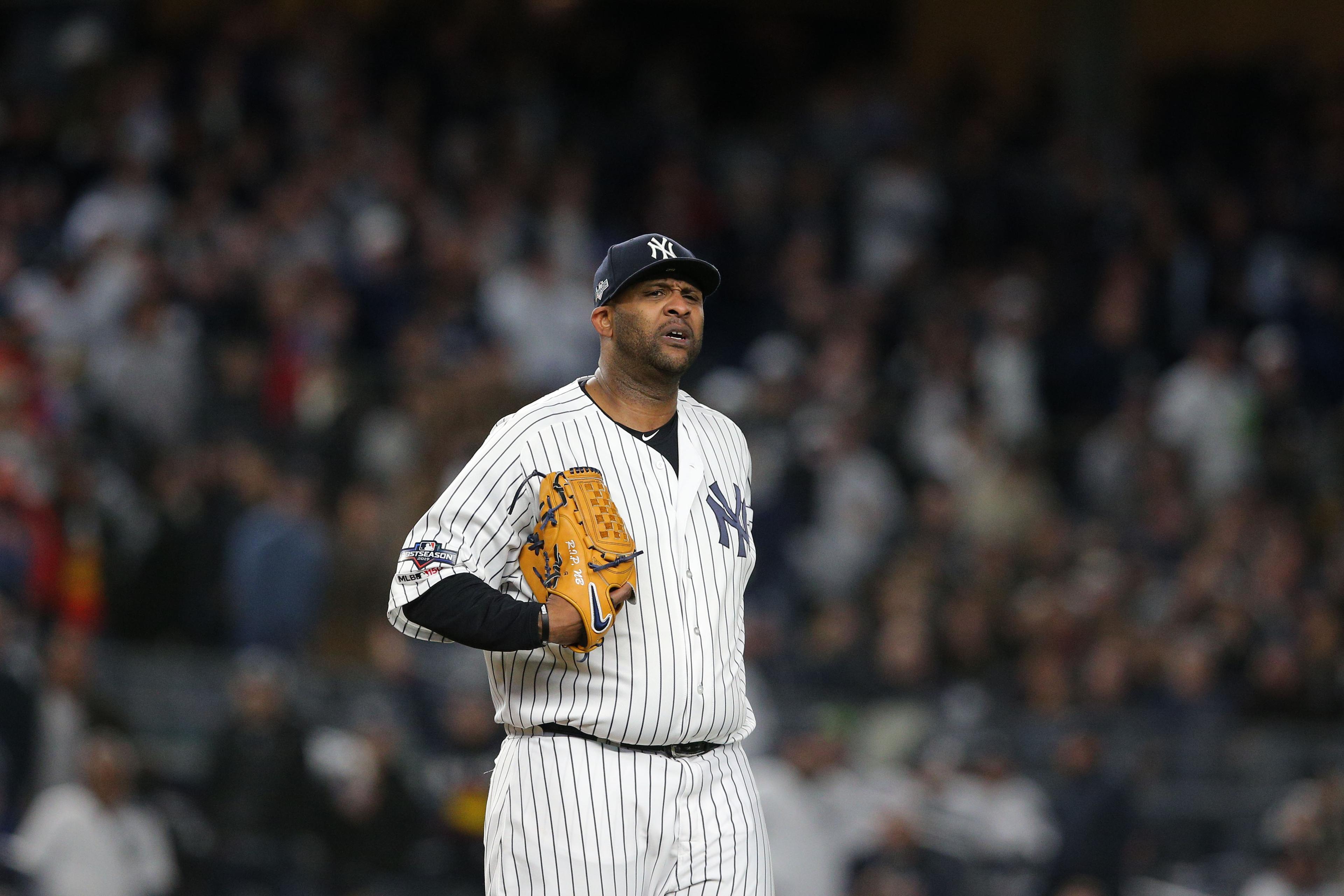 Oct 17, 2019; Bronx, NY, USA; New York Yankees starting pitcher CC Sabathia (52) reacts after an error during the eighth inning against the Houston Astros in game four of the 2019 ALCS playoff baseball series at Yankee Stadium. Mandatory Credit: Brad Penner-USA TODAY Sports