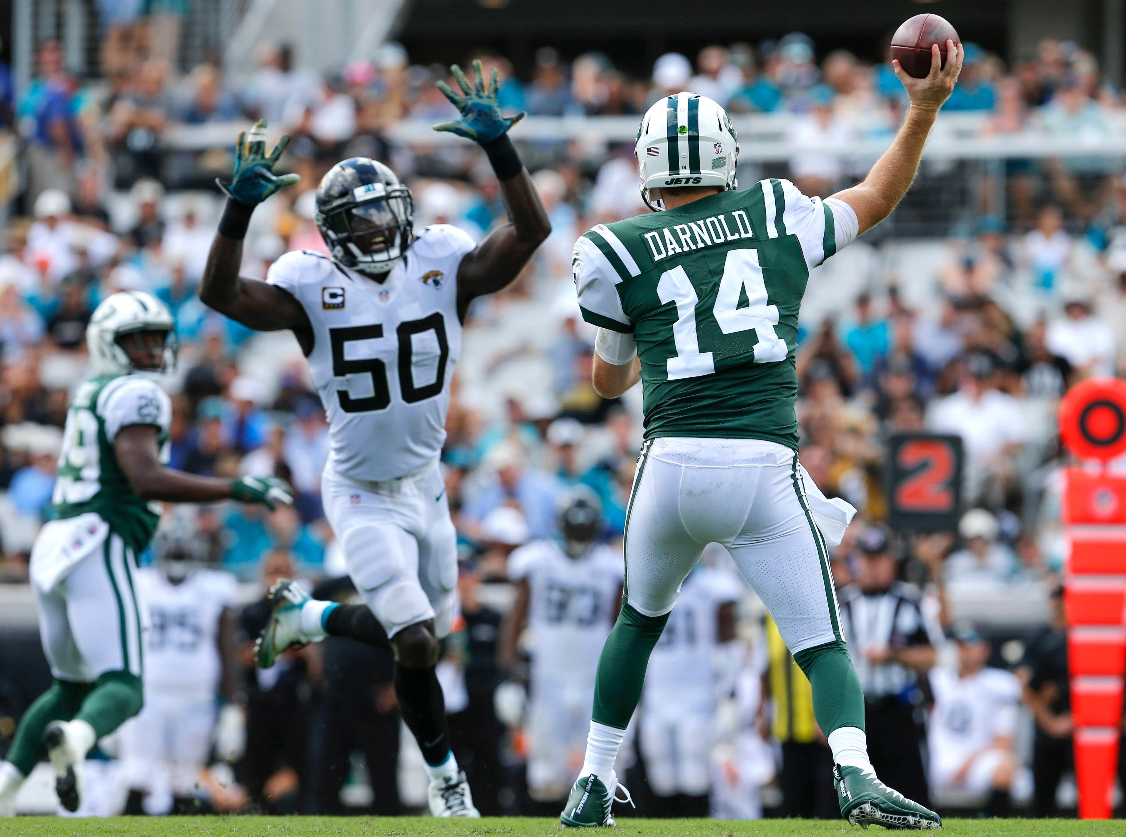 Sep 30, 2018; Jacksonville, FL, USA; New York Jets quarterback Sam Darnold (14) throws a pass under pressure from Jacksonville Jaguars linebacker Telvin Smith (50) during the second half at TIAA Bank Field. Mandatory Credit: Reinhold Matay-USA TODAY Sports / Reinhold Matay