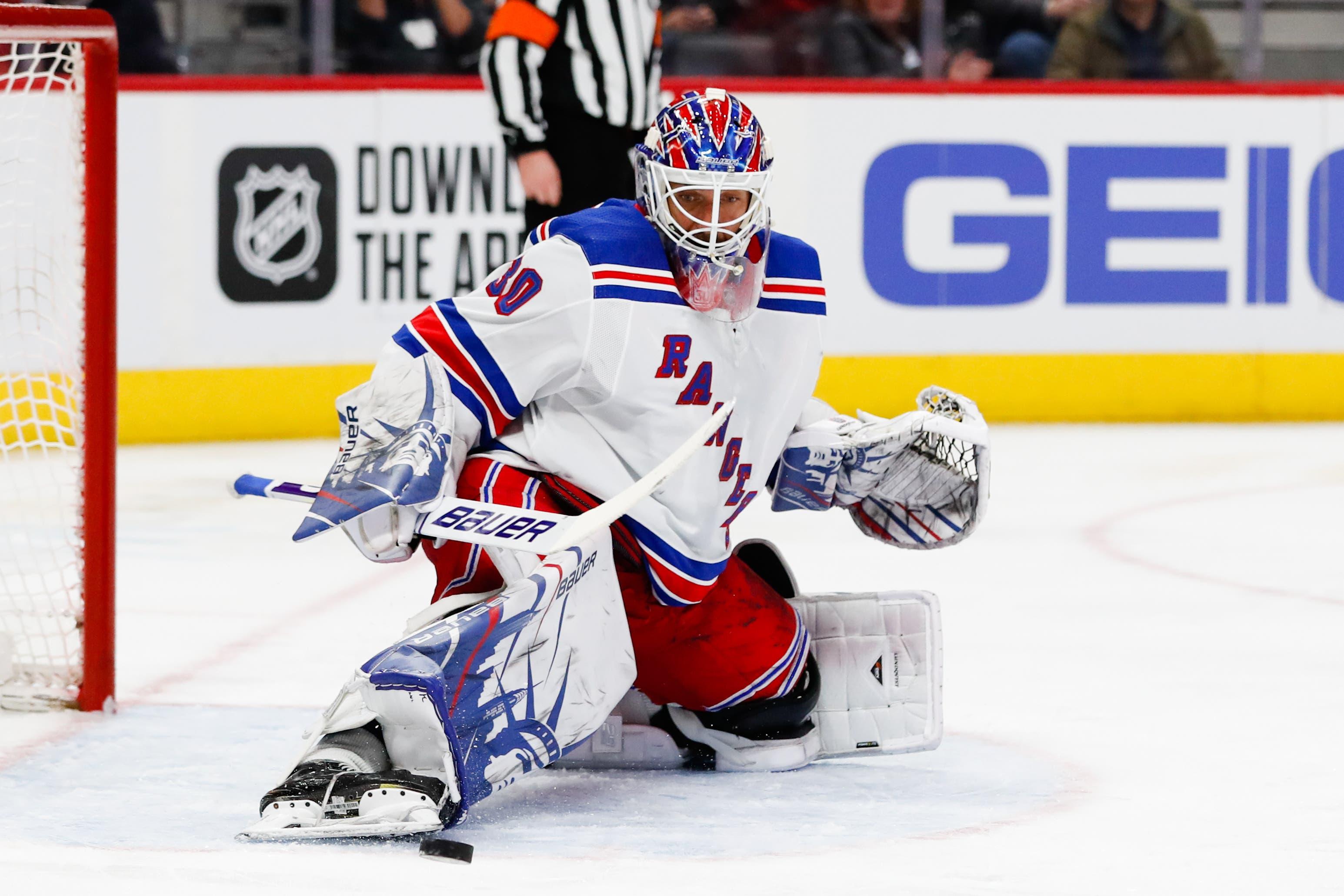 Feb 1, 2020; Detroit, Michigan, USA; New York Rangers goaltender Henrik Lundqvist (30) makes a save in the second period against the Detroit Red Wings at Little Caesars Arena. Mandatory Credit: Rick Osentoski-USA TODAY Sports / Rick Osentoski