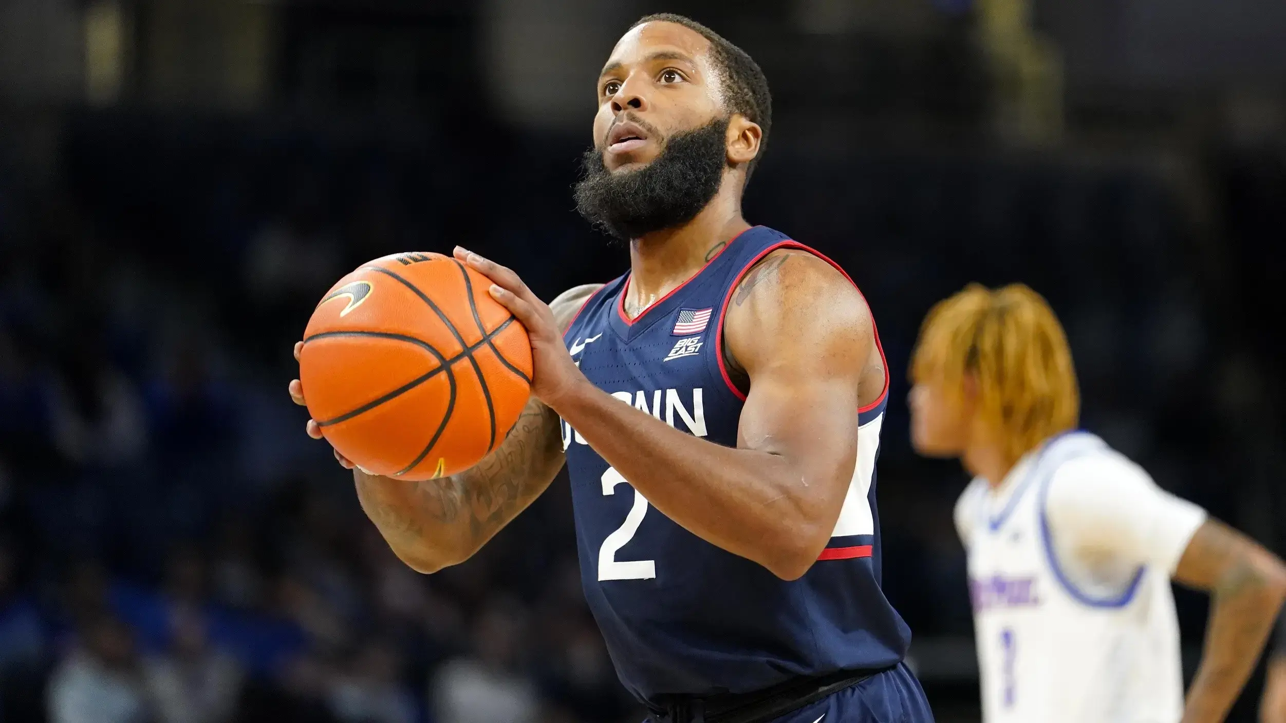 Jan 29, 2022; Chicago, Illinois, USA; Connecticut Huskies guard R.J. Cole (2) shoots a free throw against the DePaul Blue Demons during the first half at Wintrust Arena. / Mike Dinovo-USA TODAY Sports