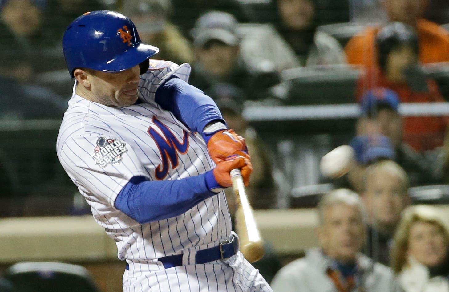 New York Mets' David Wright hits a two-run home run during the first inning of Game 3 of the Major League Baseball World Series against the Kansas City Royals Friday, Oct. 30, 2015, in New York. (AP Photo/David J. Phillip) / David J. Phillip/AP