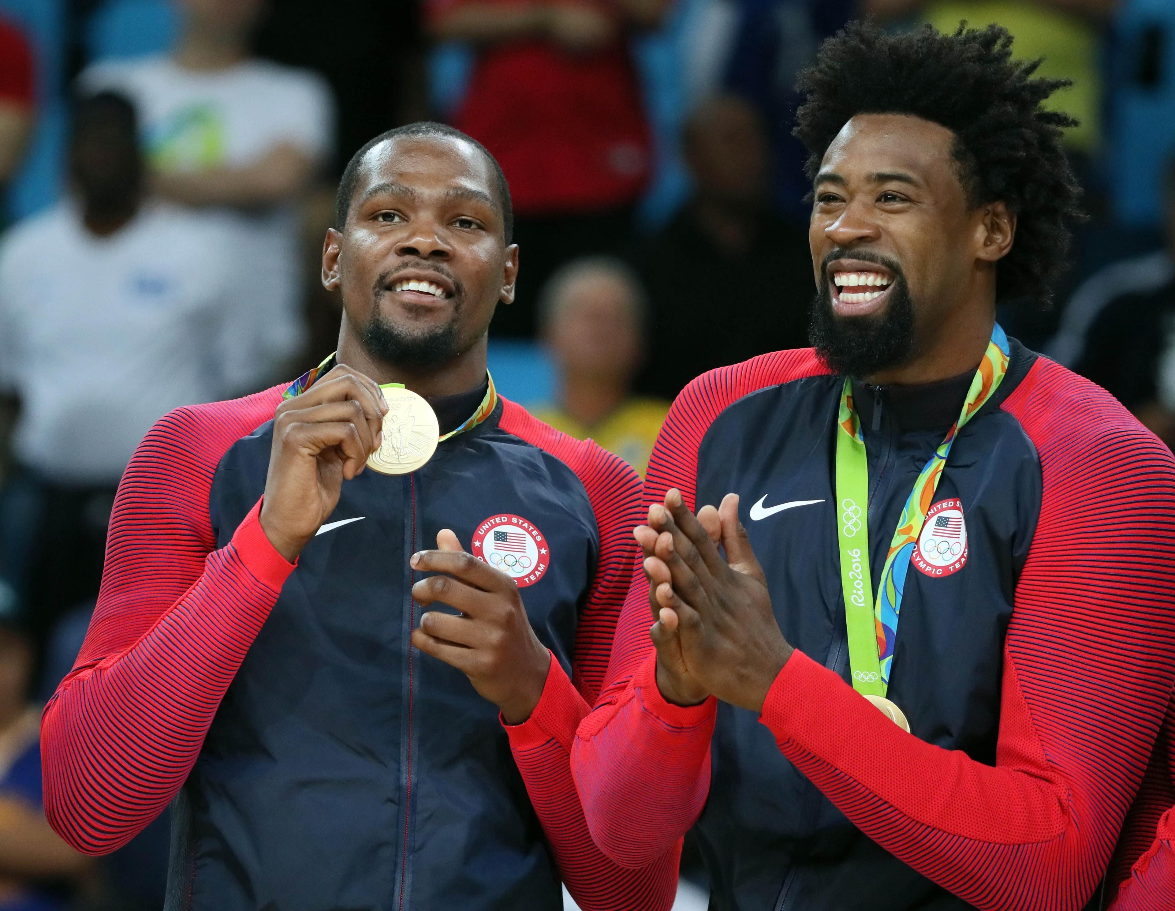 Aug 21, 2016; Rio de Janeiro, Brazil; USA forward Kevin Durant (5) and USA center DeAndre Jordan (6) celebrate winning the gold medal in the men's basketball gold medal match during the Rio 2016 Summer Olympic Games at Carioca Arena 1. Mandatory Credit: David E. Klutho-USA TODAY Sports / David E. Klutho