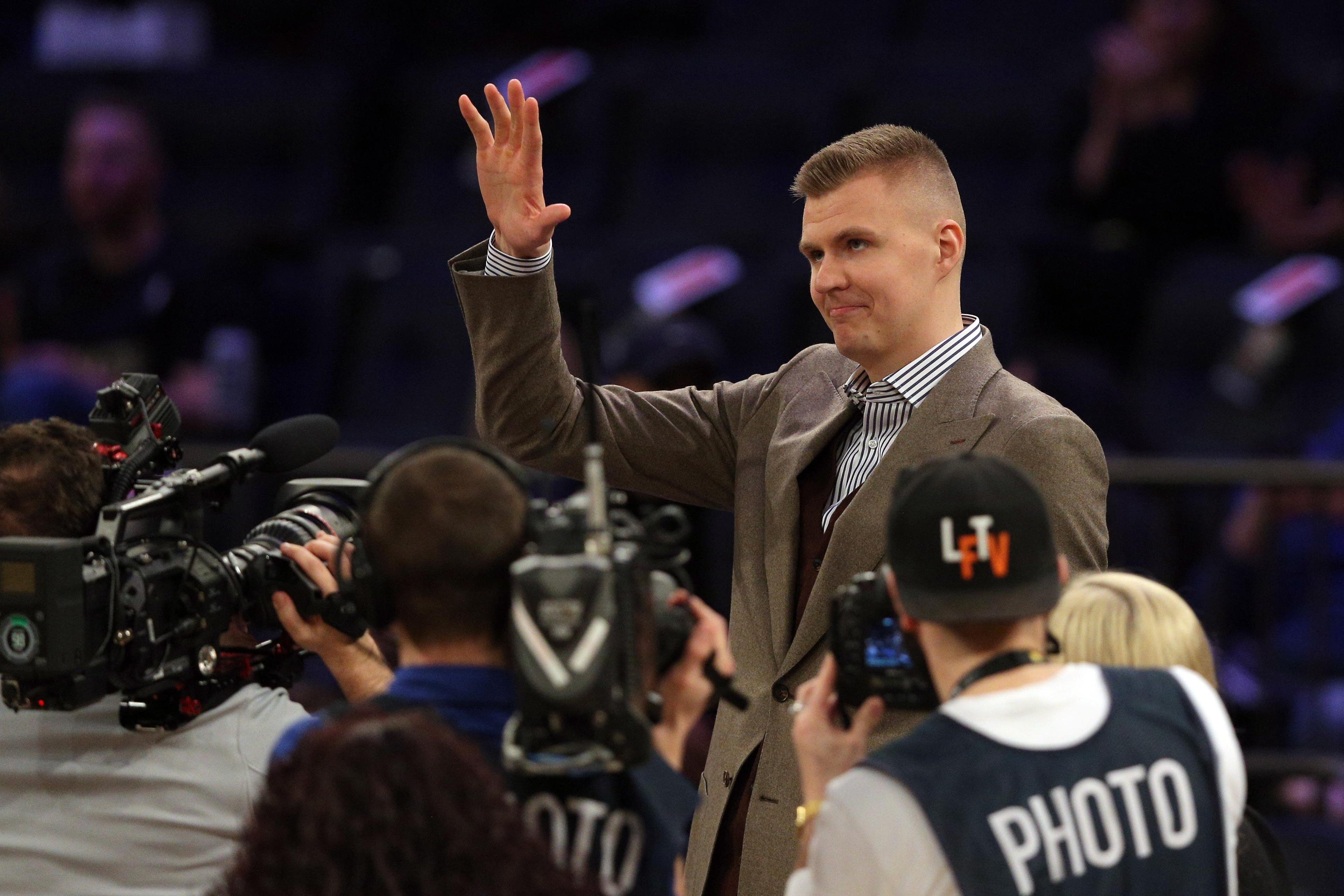 Mar 13, 2018; New York, NY, USA; New York Knicks injured power forward Kristaps Porzingis (6) waves to the fans before a game against the Dallas Mavericks at Madison Square Garden. Mandatory Credit: Brad Penner-USA TODAY Sports / Brad Penner