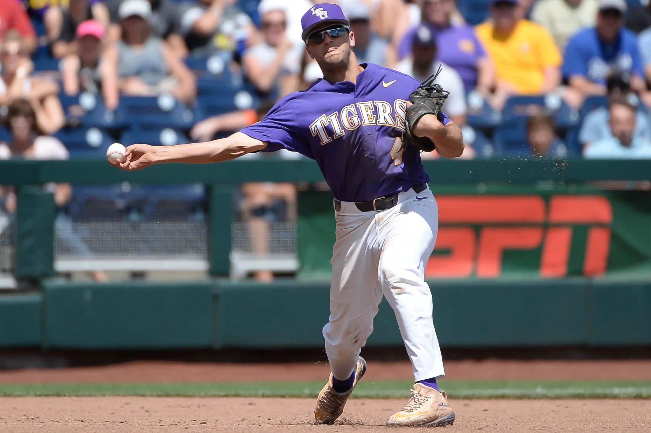 LSU Tigers infielder Josh Smith throws to first base in the third inning against the Oregon State Beavers at TD Ameritrade Park Omaha.