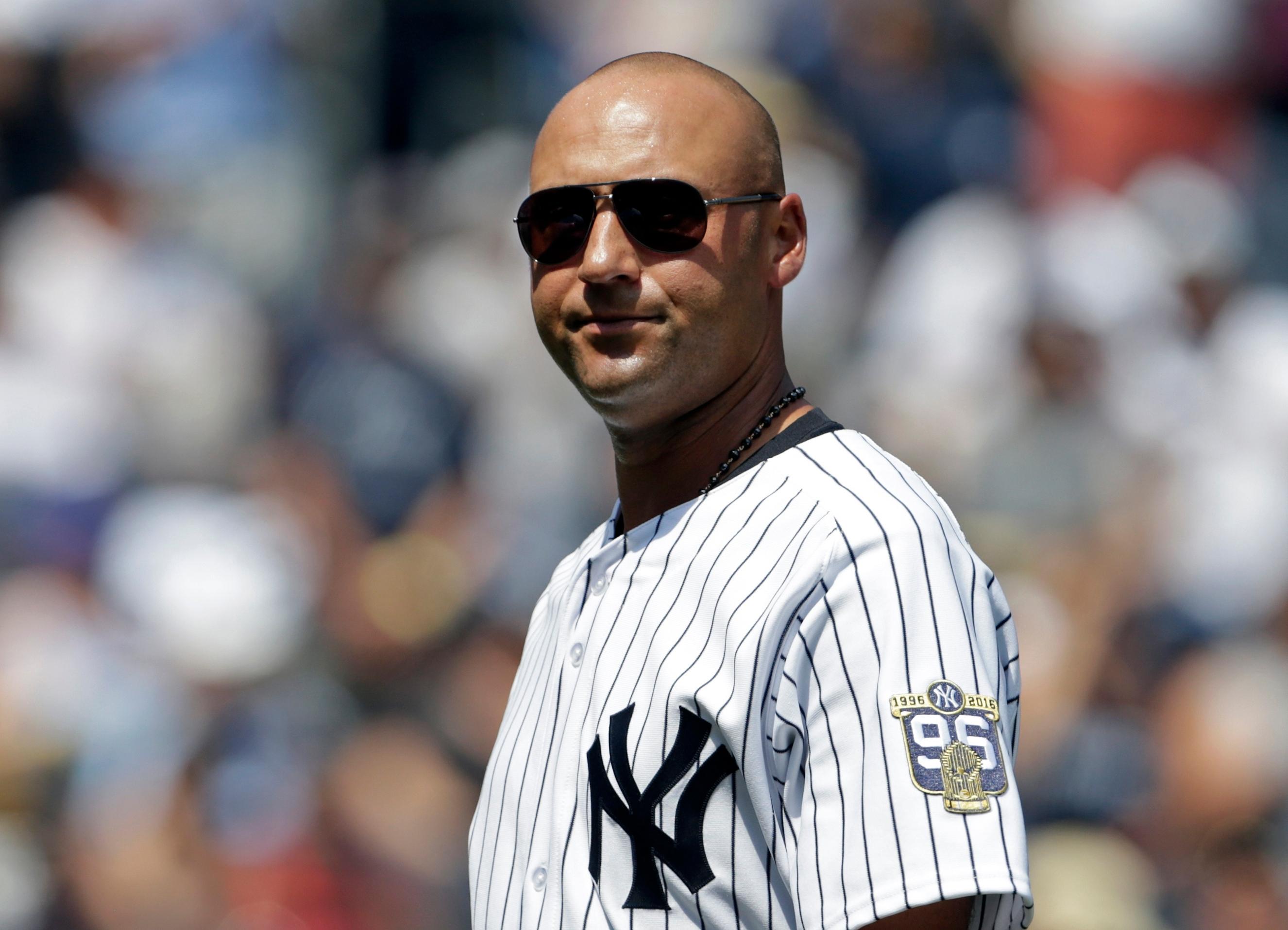 Aug 13, 2016; Bronx, NY, USA; Former New York Yankees Derek Jeter leaves the field following a ceremony for the reunion of the 1996 World Series Championship Team prior to a game against the Tampa Bay Rays at Yankee Stadium. Mandatory Credit: Adam Hunger-USA TODAY Sports