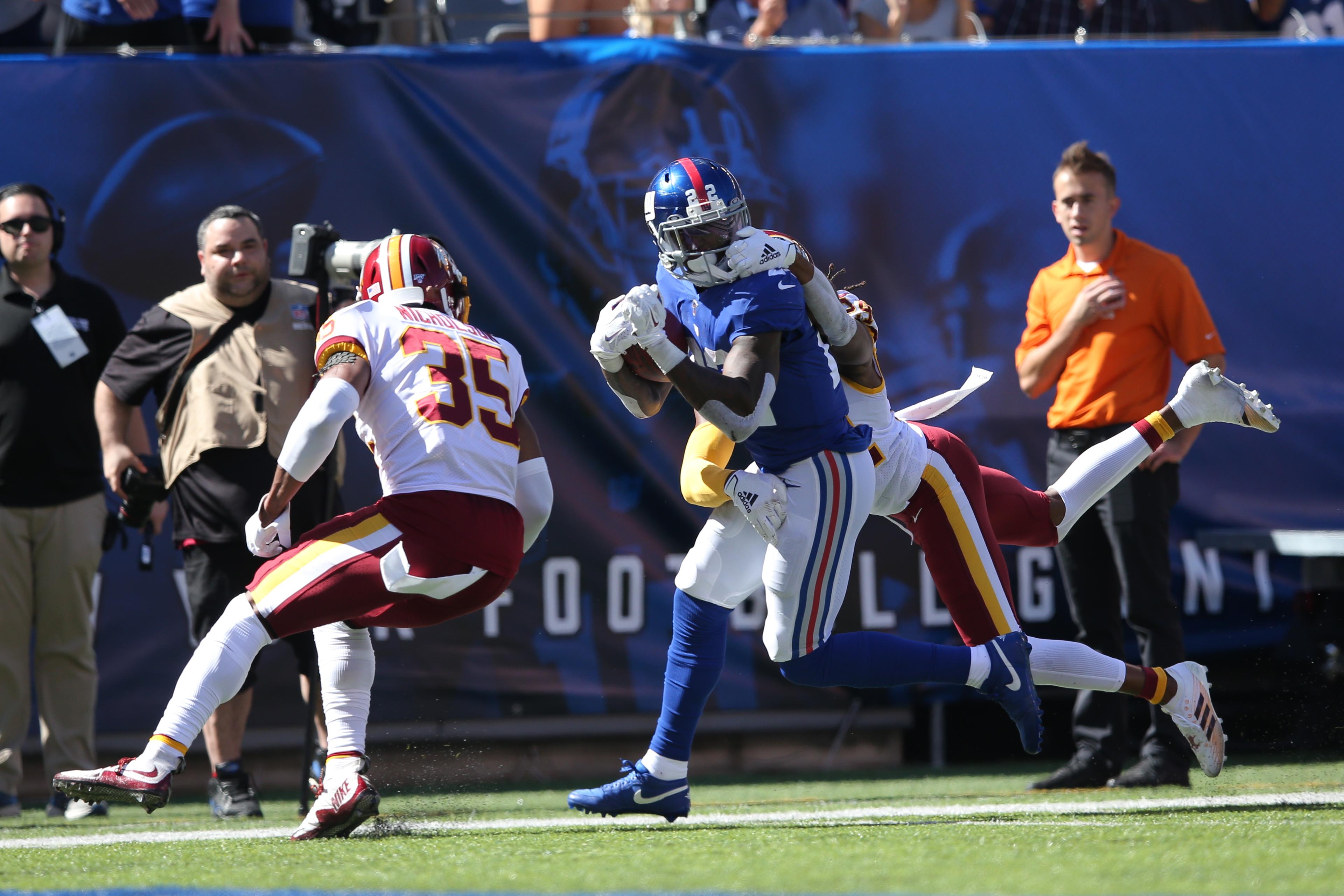 Sep 29, 2019; East Rutherford, NJ, USA; Washington Redskins cornerback Josh Norman (24) commits a facemask penalty while tackling New York Giants running back Wayne Gallman (22) during the second quarter at MetLife Stadium. Mandatory Credit: Brad Penner-USA TODAY Sports