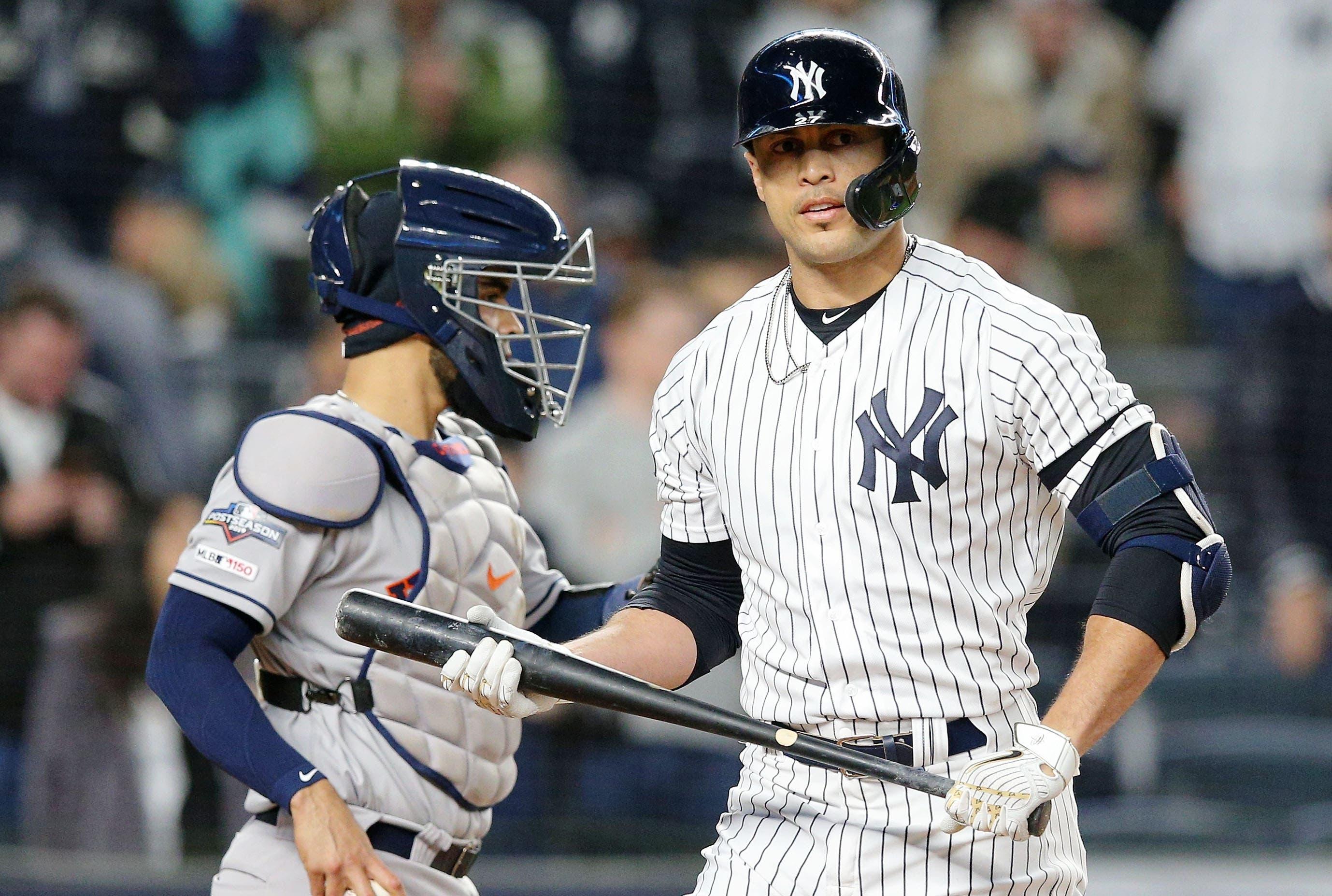 Oct 18, 2019; Bronx, NY, USA; New York Yankees designated hitter Giancarlo Stanton (27) reacts after striking out against the Houston Astros during the first inning of game five of the 2019 ALCS playoff baseball series at Yankee Stadium. Mandatory Credit: Brad Penner-USA TODAY Sports / Brad Penner