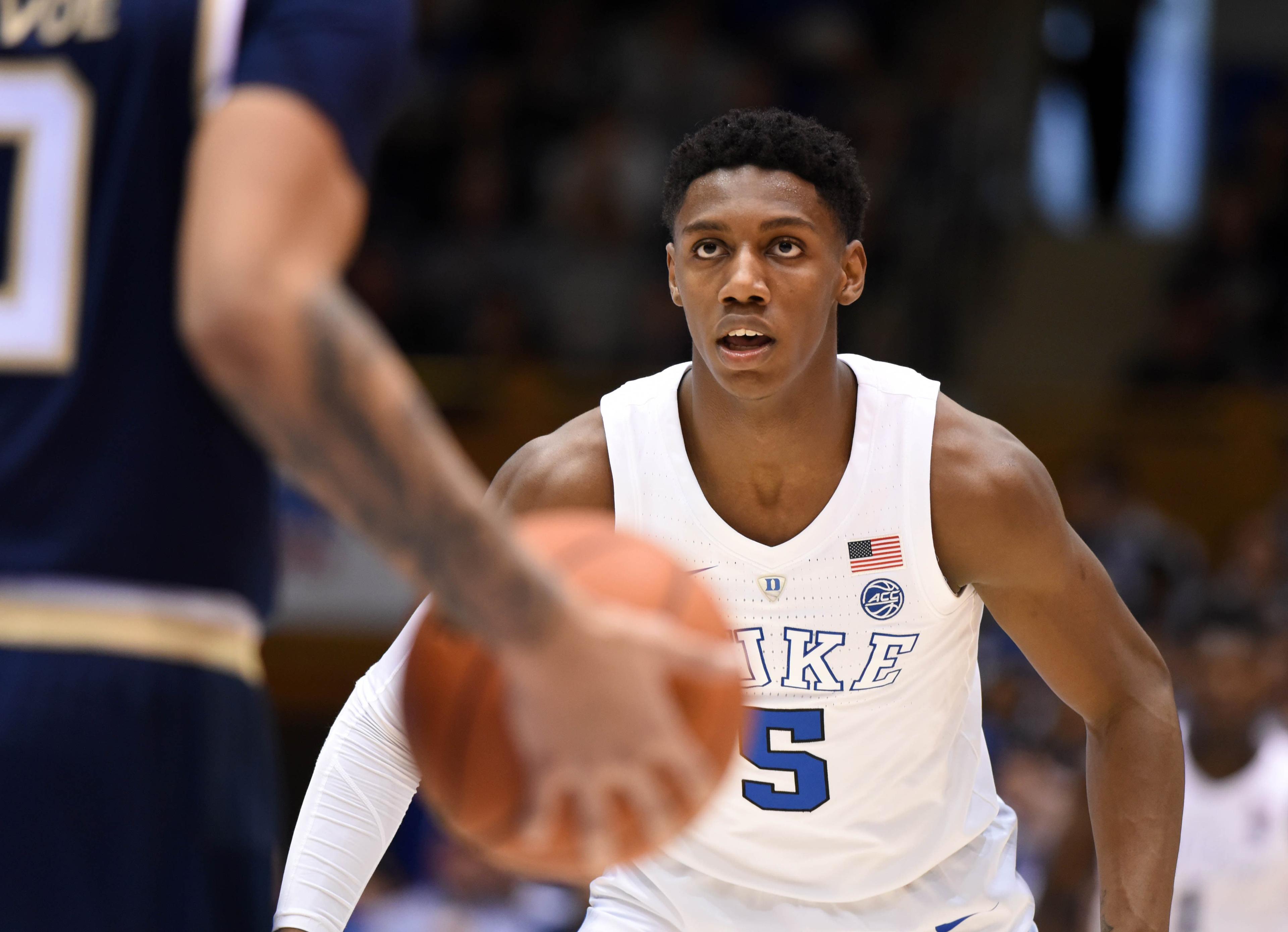 Duke Blue Devils forward R.J. Barrett plays defense as Georgia Tech Yellowjackets guard Michael Devoe dribbles up court during the second half at Cameron Indoor Stadium. / Rob Kinnan/USA TODAY Sports