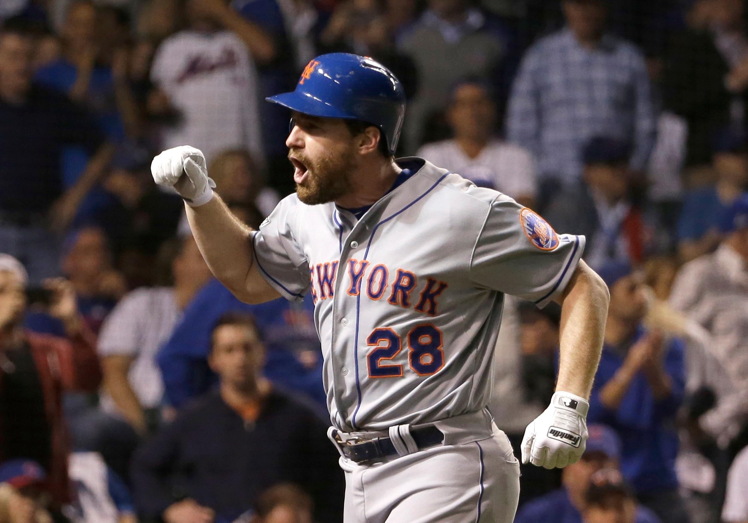 New York Mets' Daniel Murphy celebrates after hitting a two-run home run during the eighth inning of Game 4 of the National League baseball championship series against the Chicago Cubs Wednesday, Oct. 21, 2015, in Chicago. (AP Photo/David J. Phillip) 